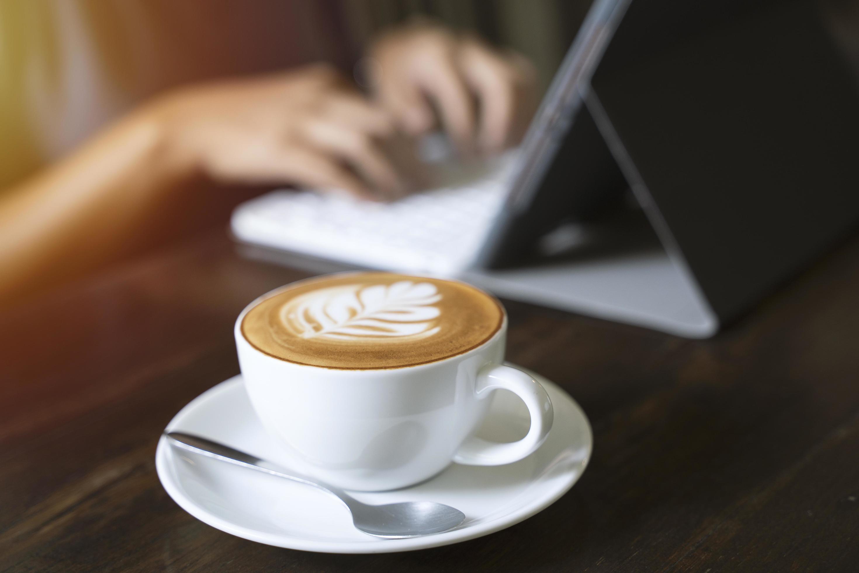 Hipster asian woman typing on tablet in the cafe with sunlight, lifestyle concept Stock Free