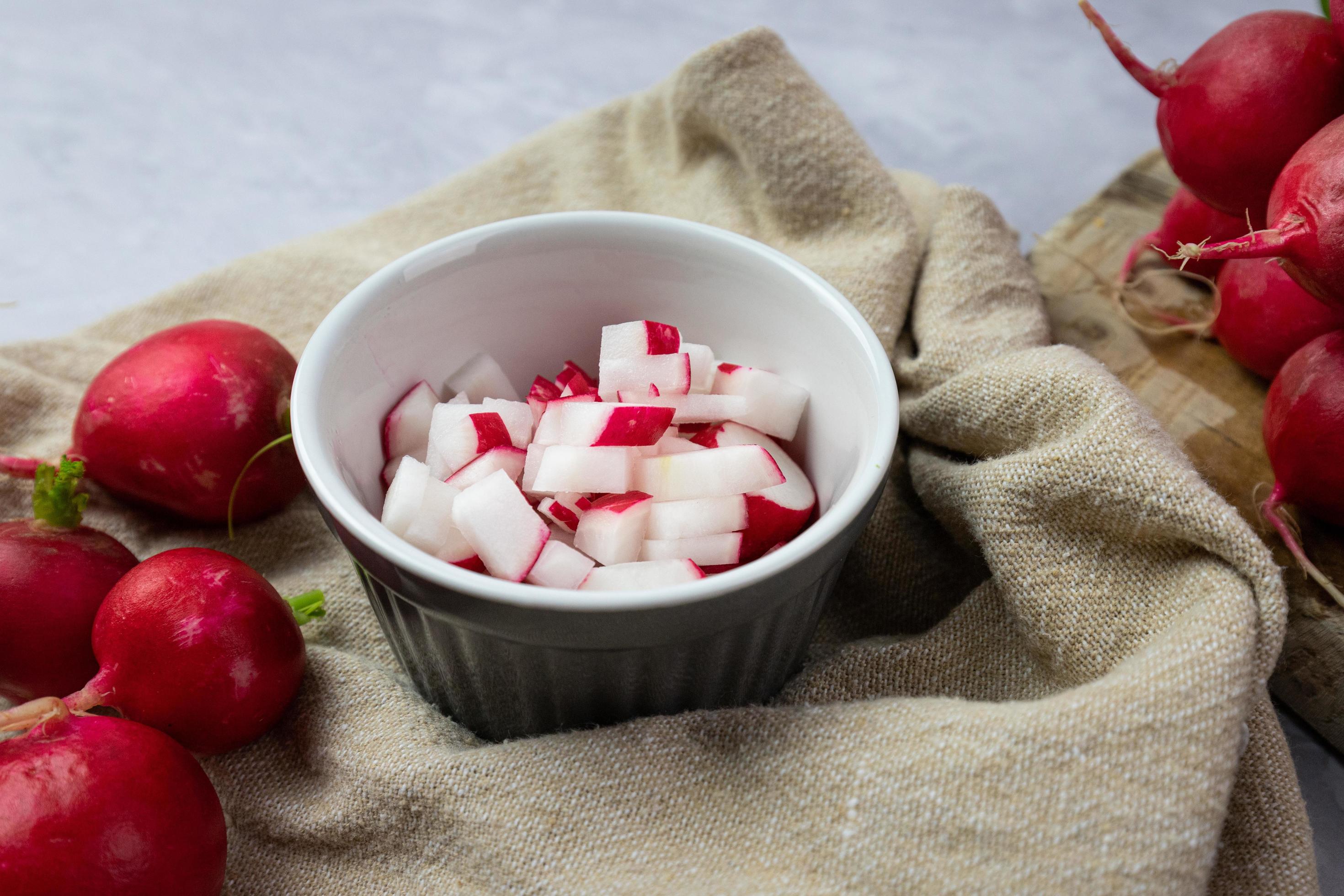 Chopped radish in a bowl. Preparation of ingredients for food. Stock Free