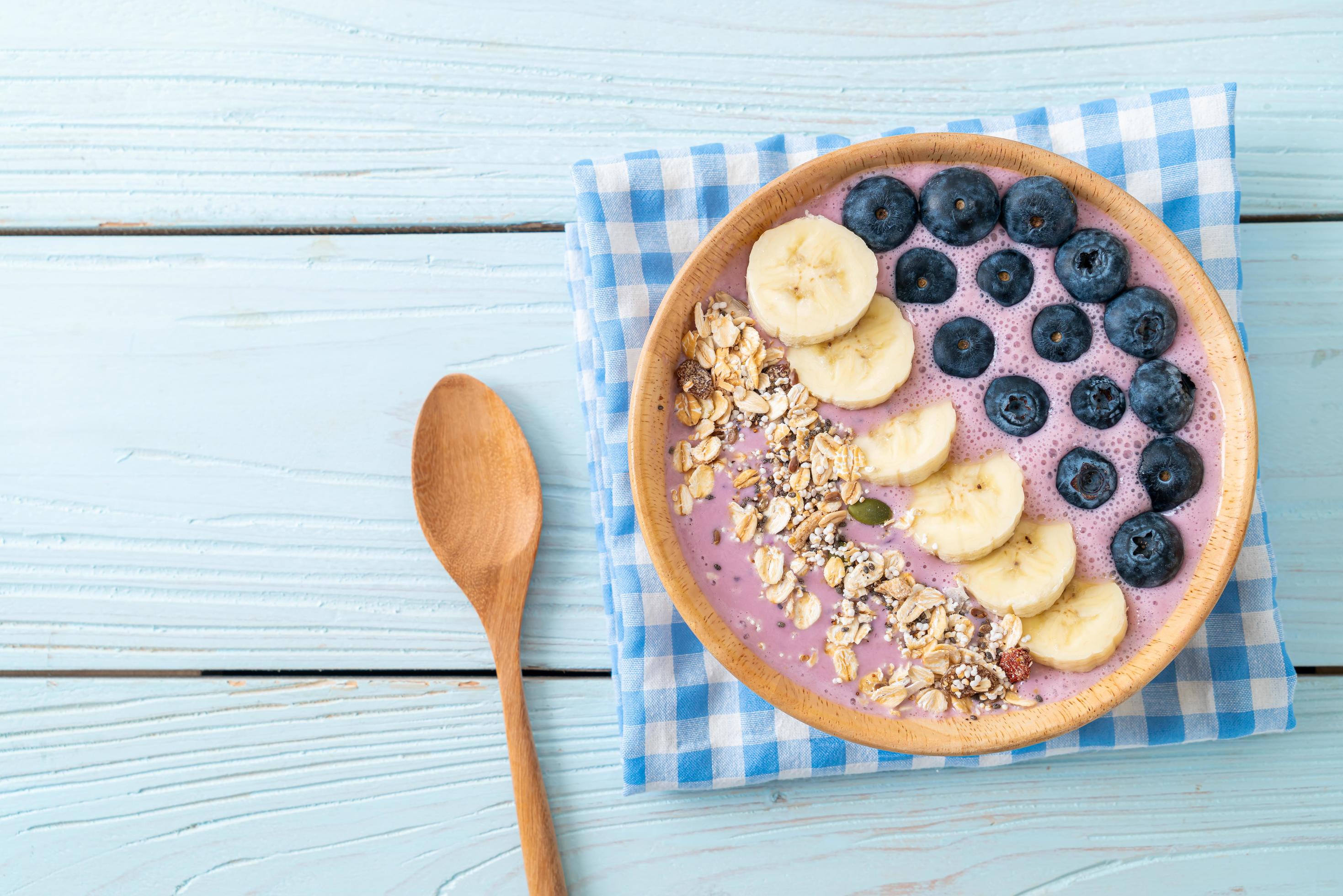 Yogurt or smoothie bowl with blueberry, banana, and granola – Healthy food style Stock Free