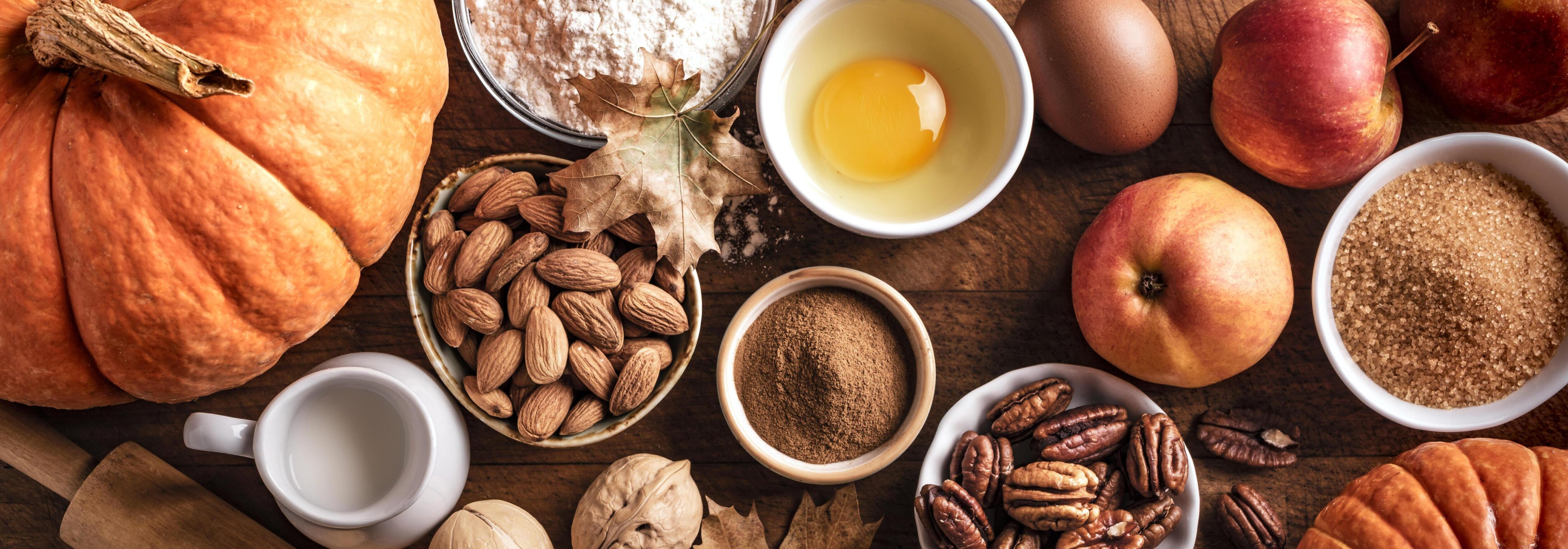 Autumn baking background with pumpkins, apples and nuts Stock Free