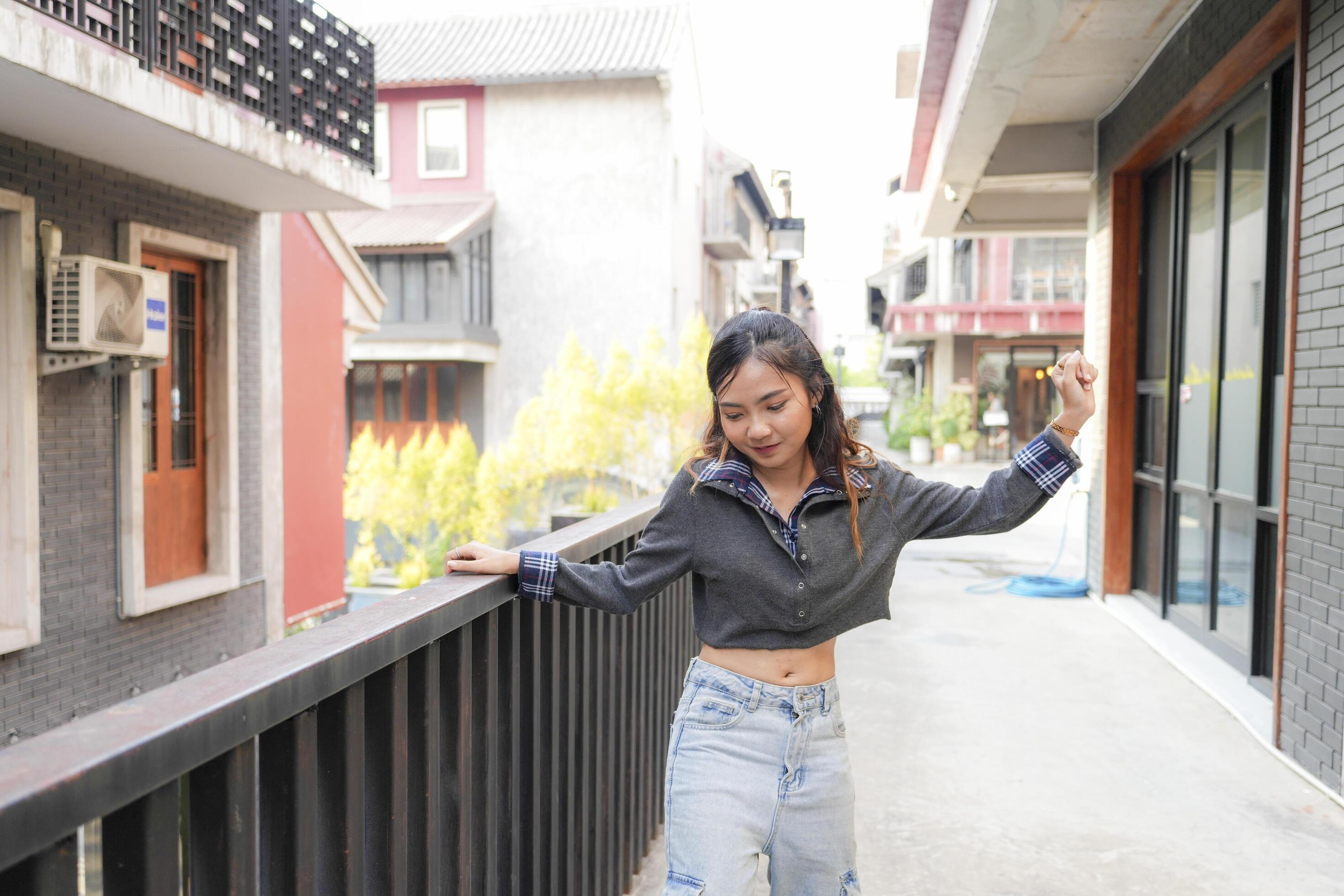 Asian women do freestyle hip hop and breakdancing in a public space in the middle of the city. With a cheerful and happy attitude Stock Free