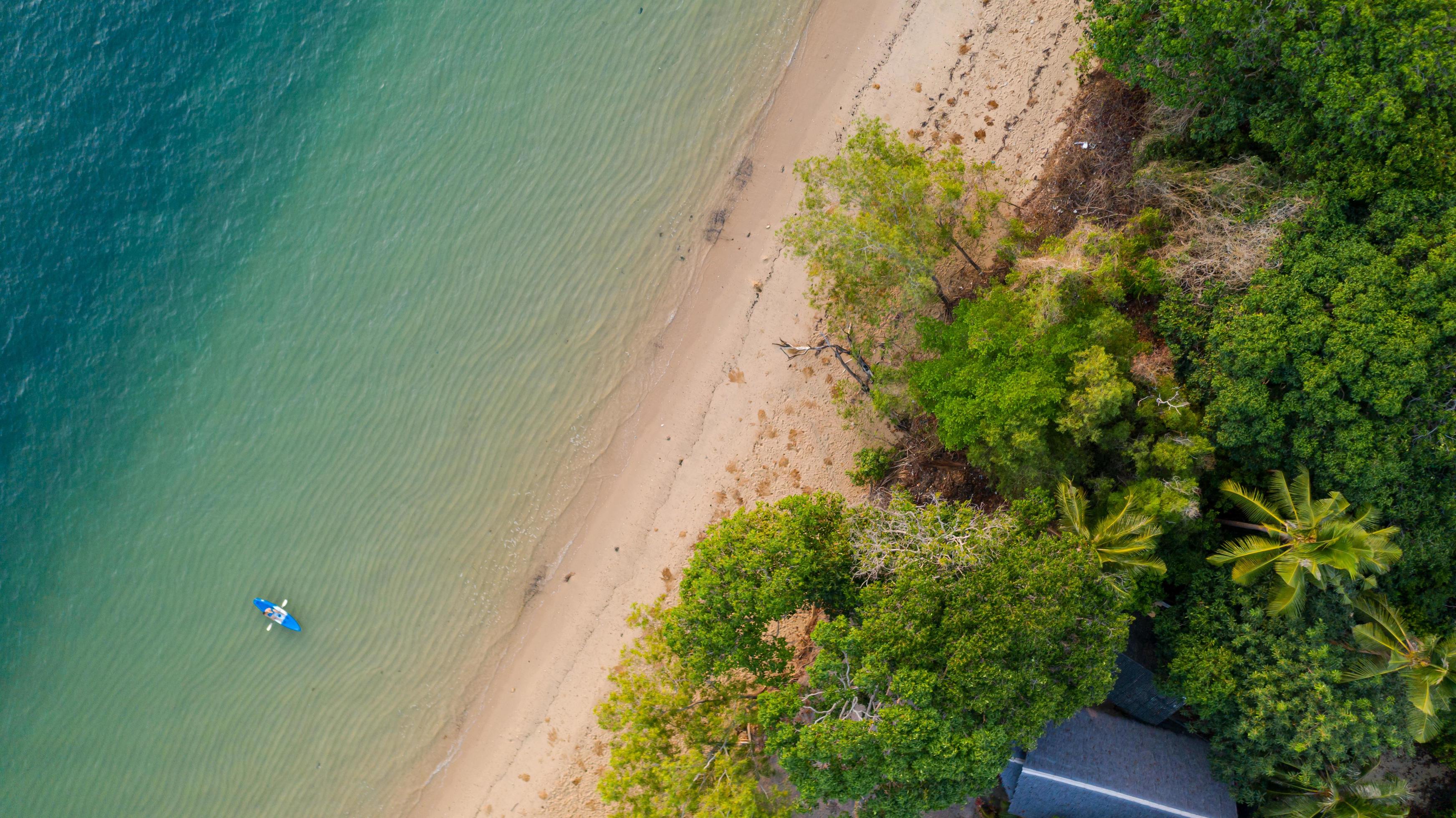 Aerial view Sea view Amazing thailand nature background Water and beautifully bright beach with kayak on ocean at sunny day Stock Free