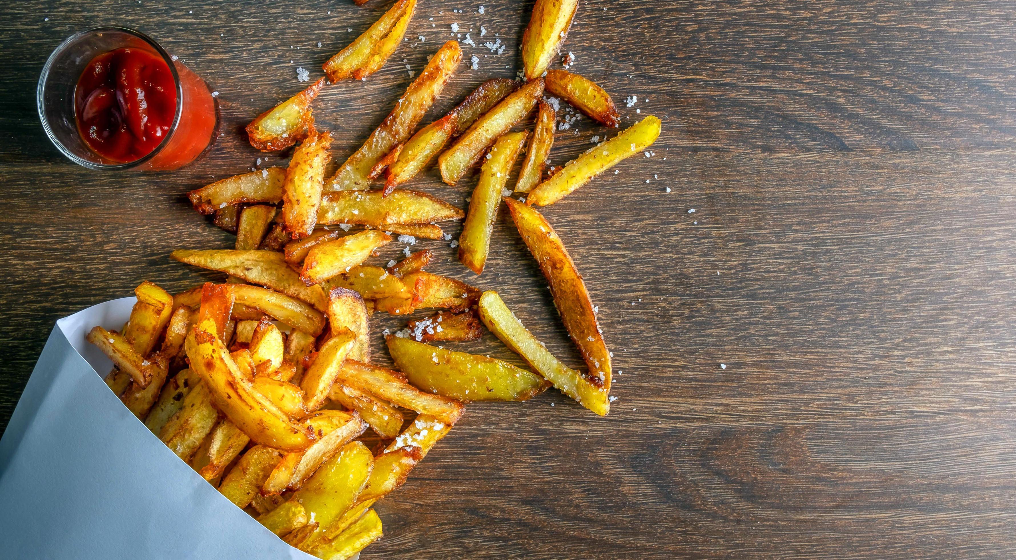 Menu fast food of French fries or fried potatoes homemade on wooden background.top view Stock Free