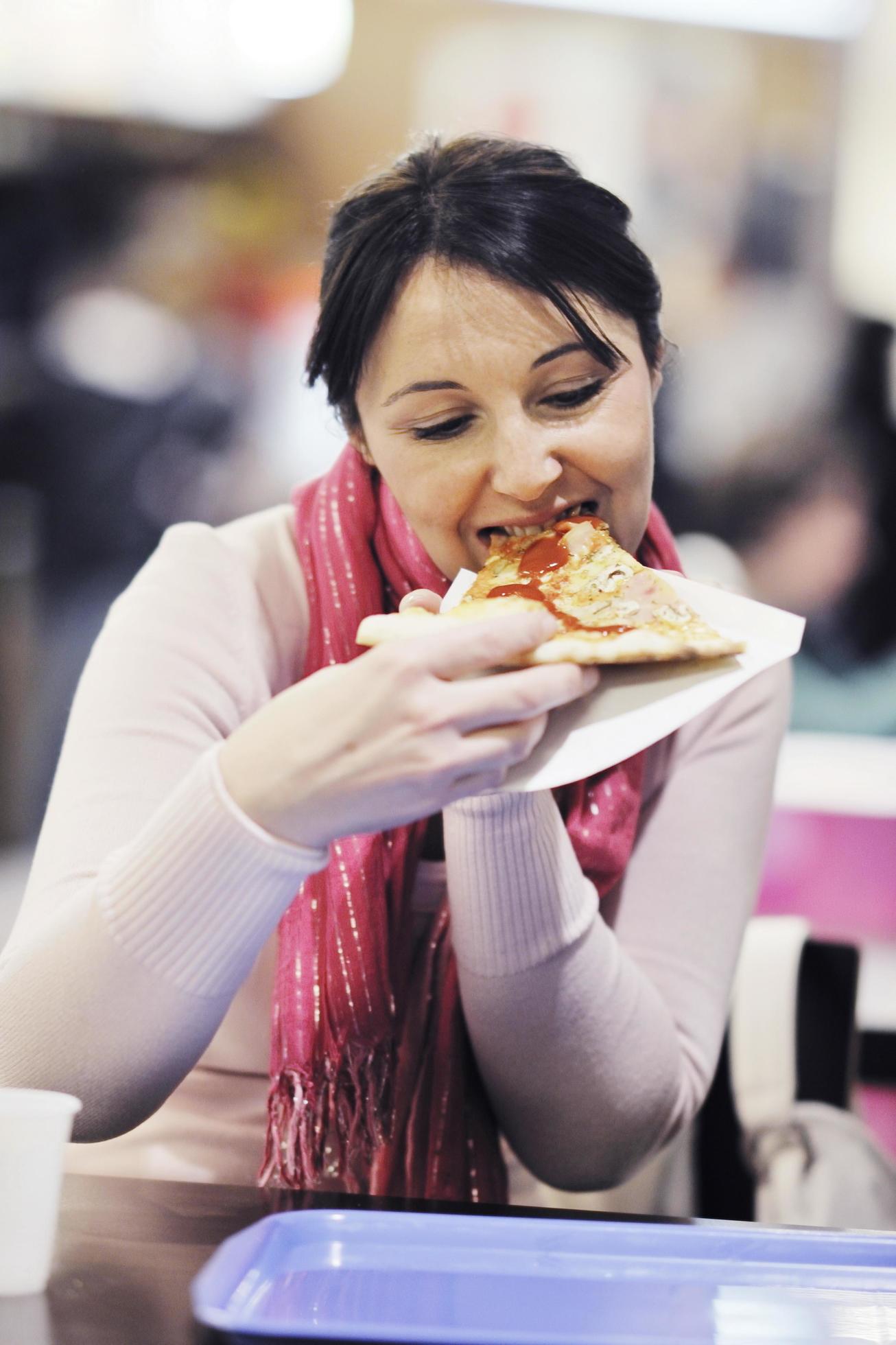 woman eat pizza food at restaurant Stock Free