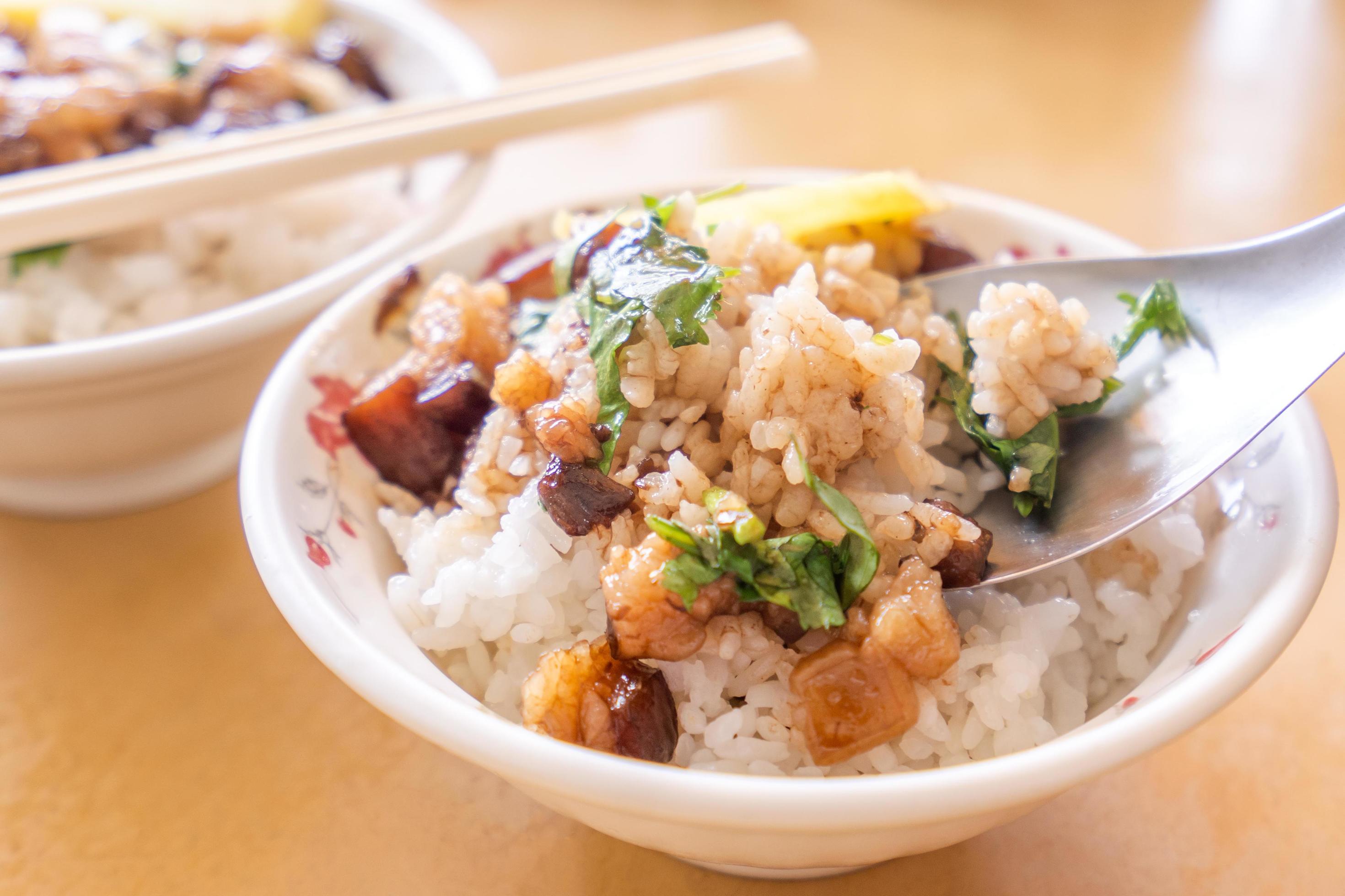 Braised pork over rice – Taiwan famous traditional street food delicacy. Soy-stewed pork on rice. Travel design concept. Top view,copy space,close up Stock Free