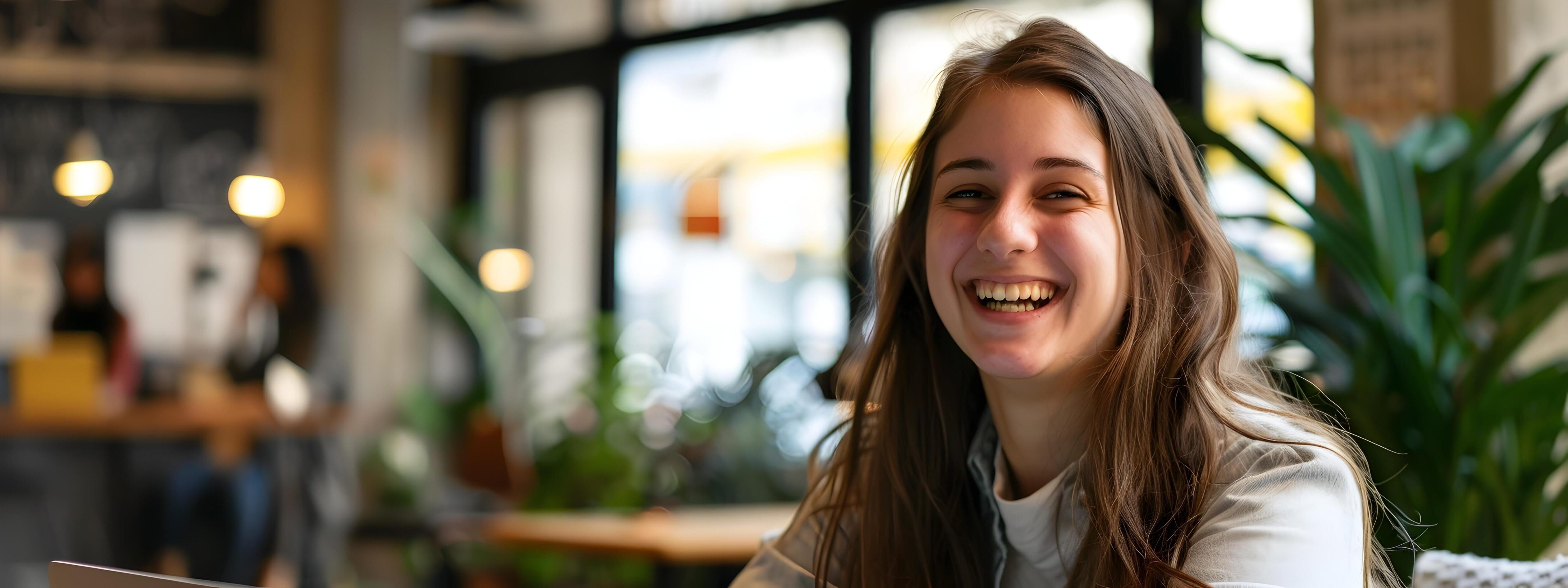 Confident and Cheerful Young Businesswoman Enjoying Work in Cozy Office Environment Stock Free