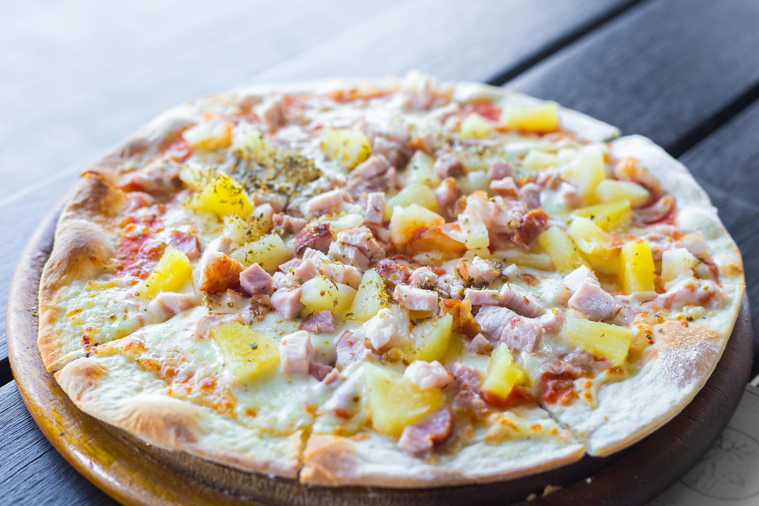 Hawaiian pizza is a Italian food which it made with tomato sauce, chopped pineapple, ham and cheese. Stock Free