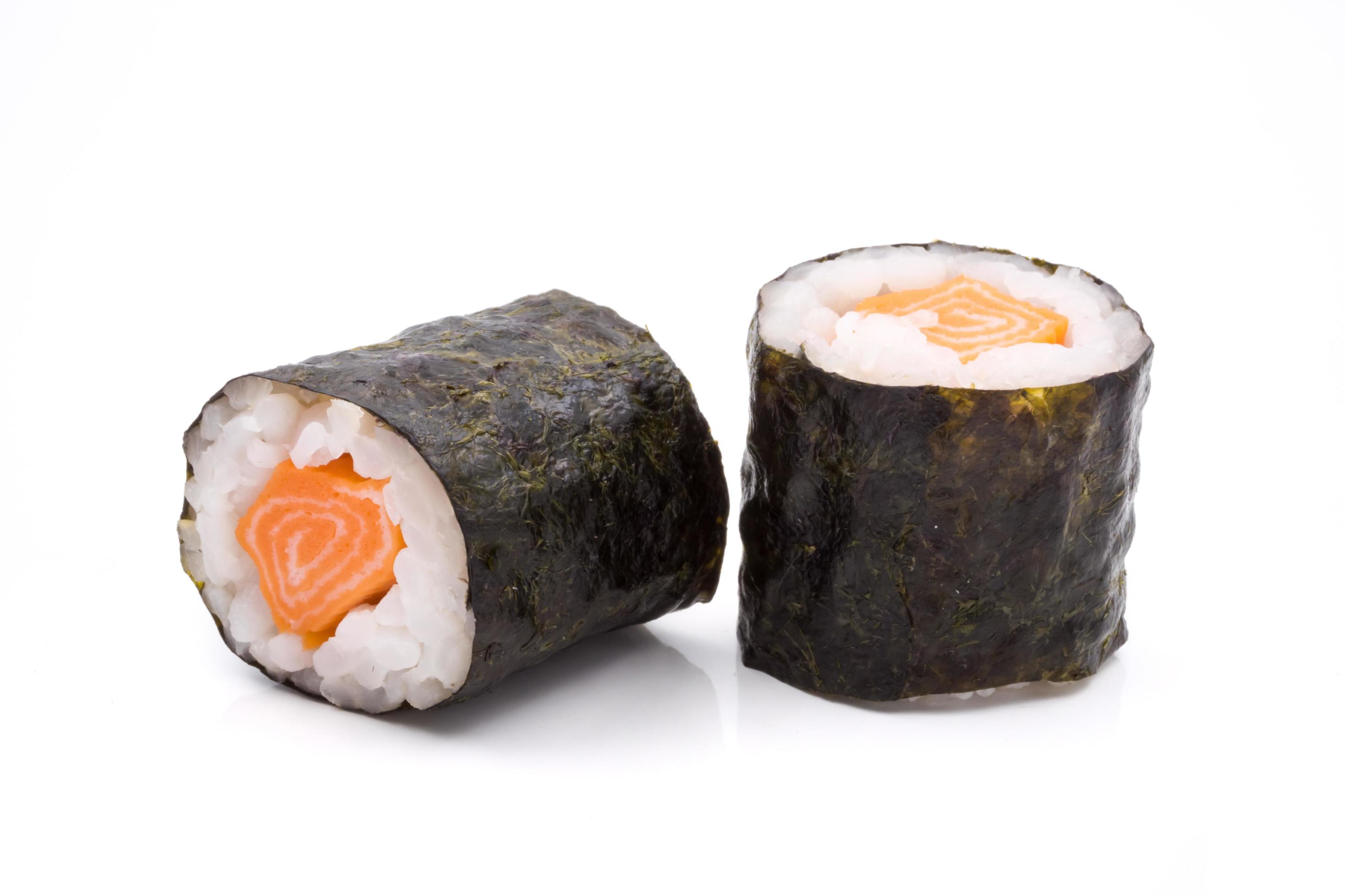 Sushi rolls, rice with salmon and seaweed on white background, japanese food. Stock Free