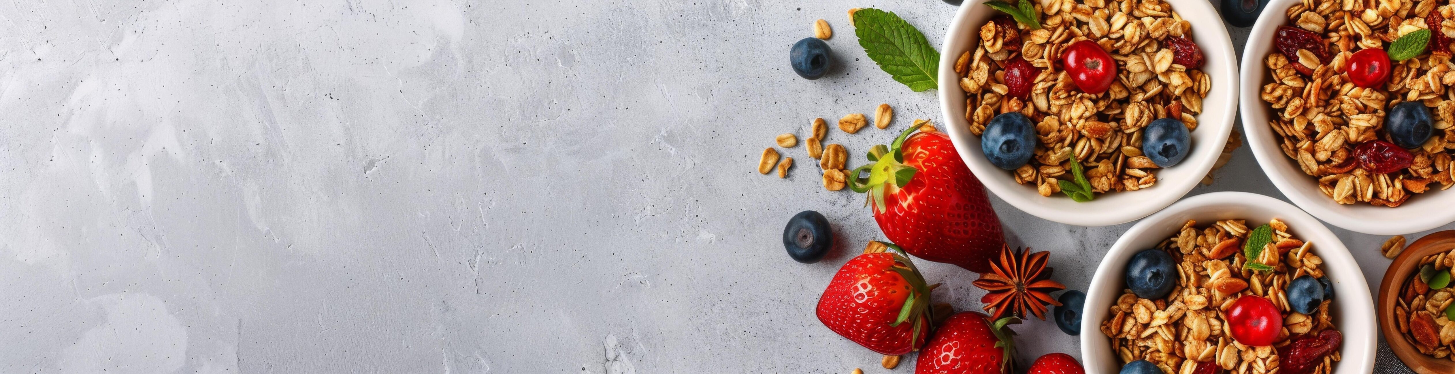 White Marble Surface With Bowls of Yogurt, Granola, and Raspberries Stock Free