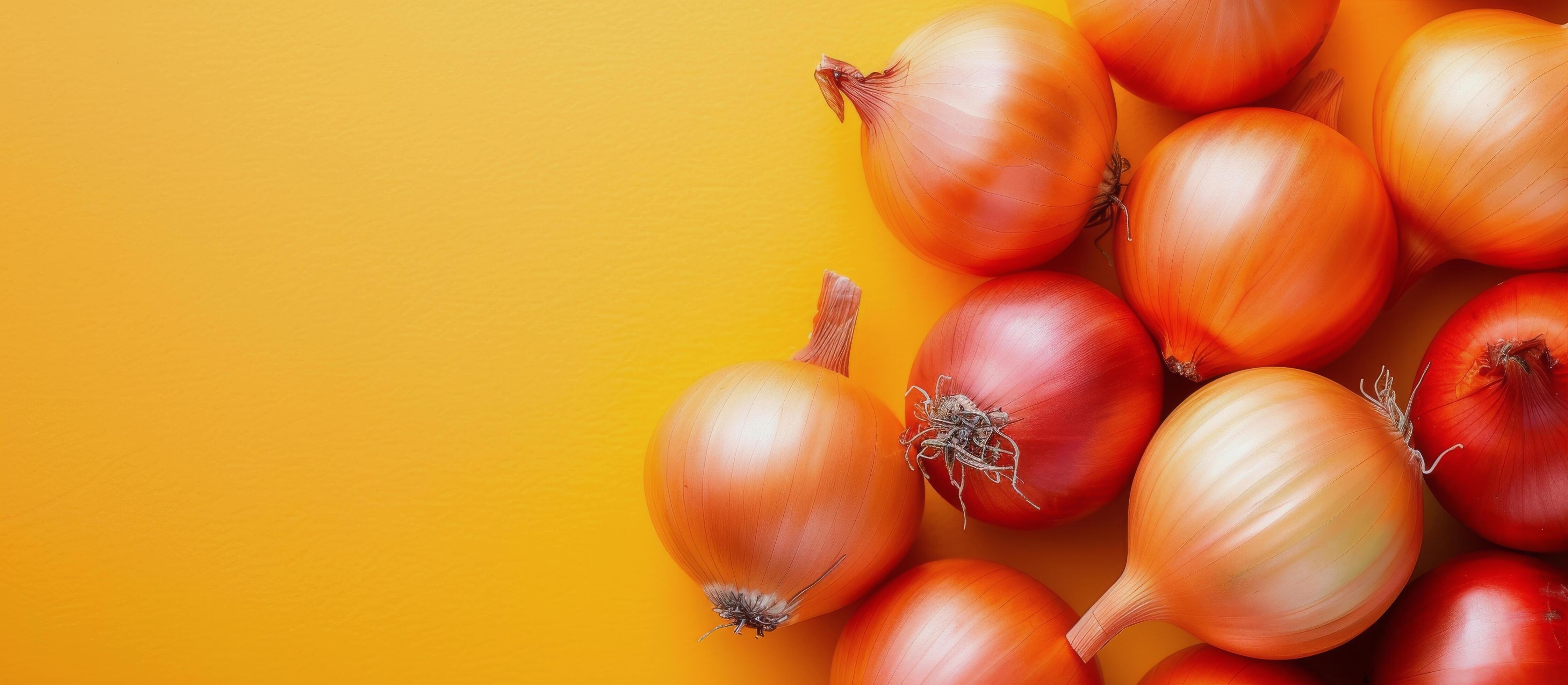 Variety of Fresh Onions on Yellow Background Stock Free