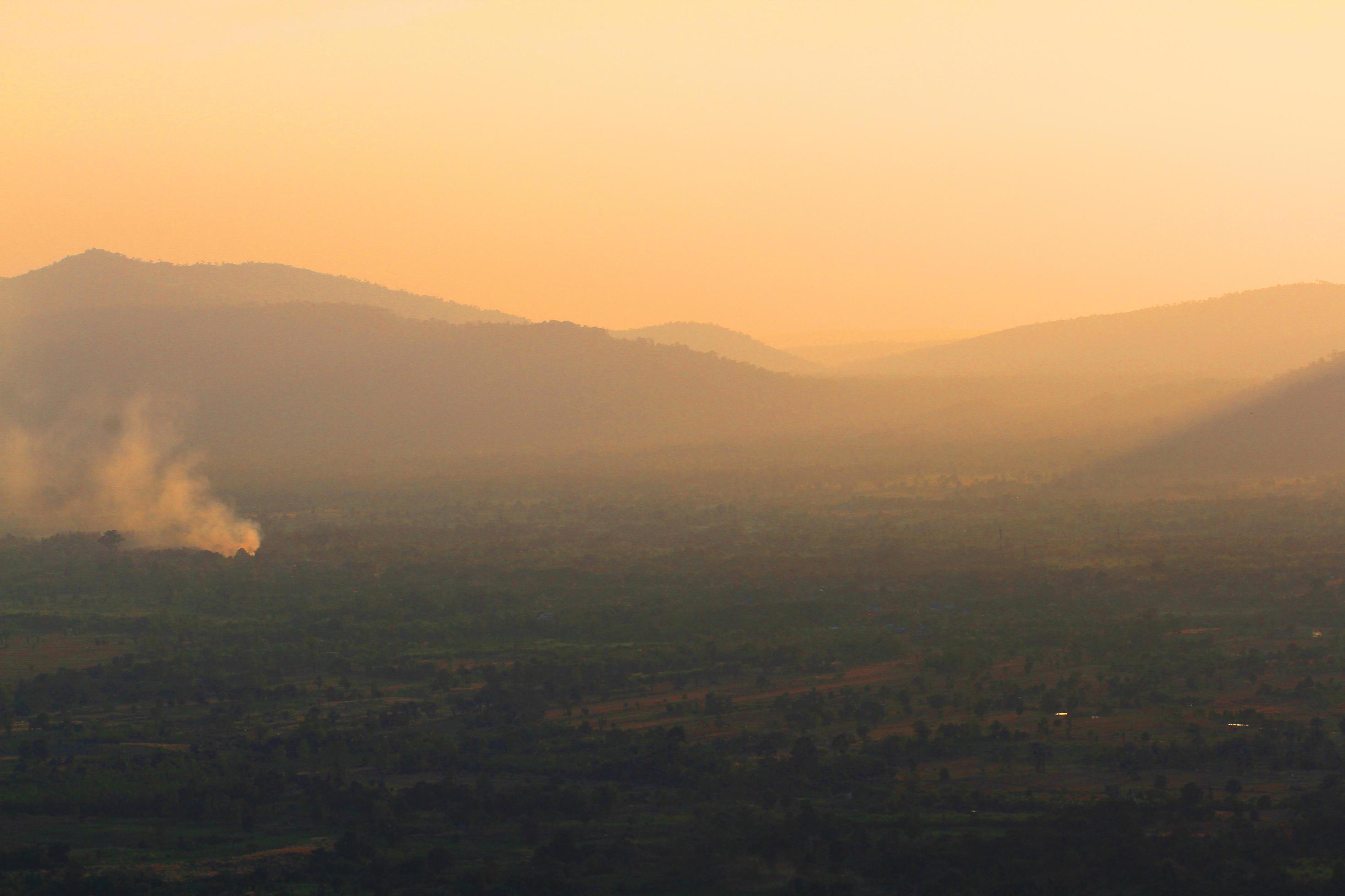 Beautiful landscape layers of mountain and Misty on hill valley in golden twilight of sunset at Thailand Stock Free