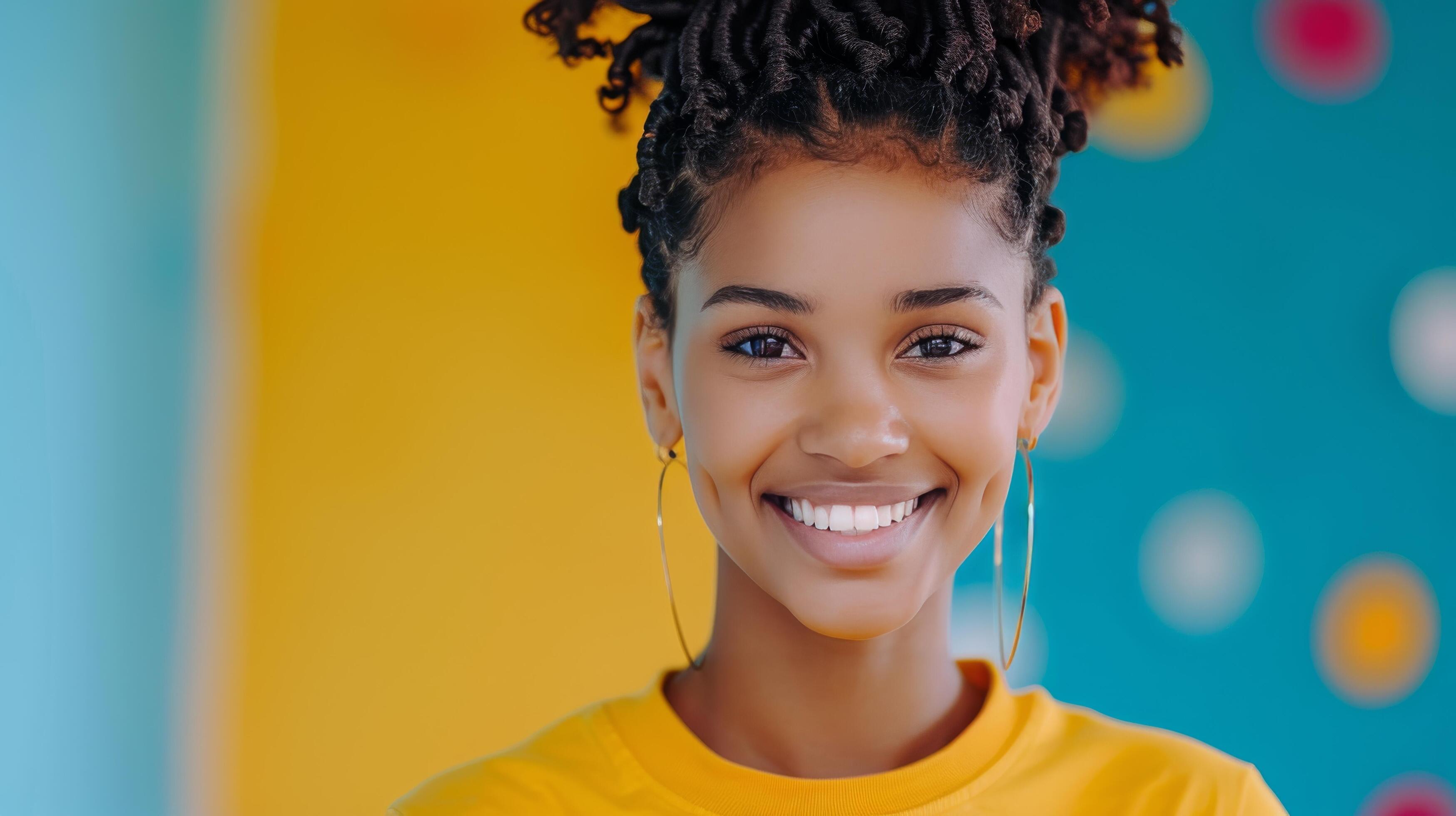 Smiling Young Girl With Natural Hair Posing Against Colorful Background in Bright Room Stock Free