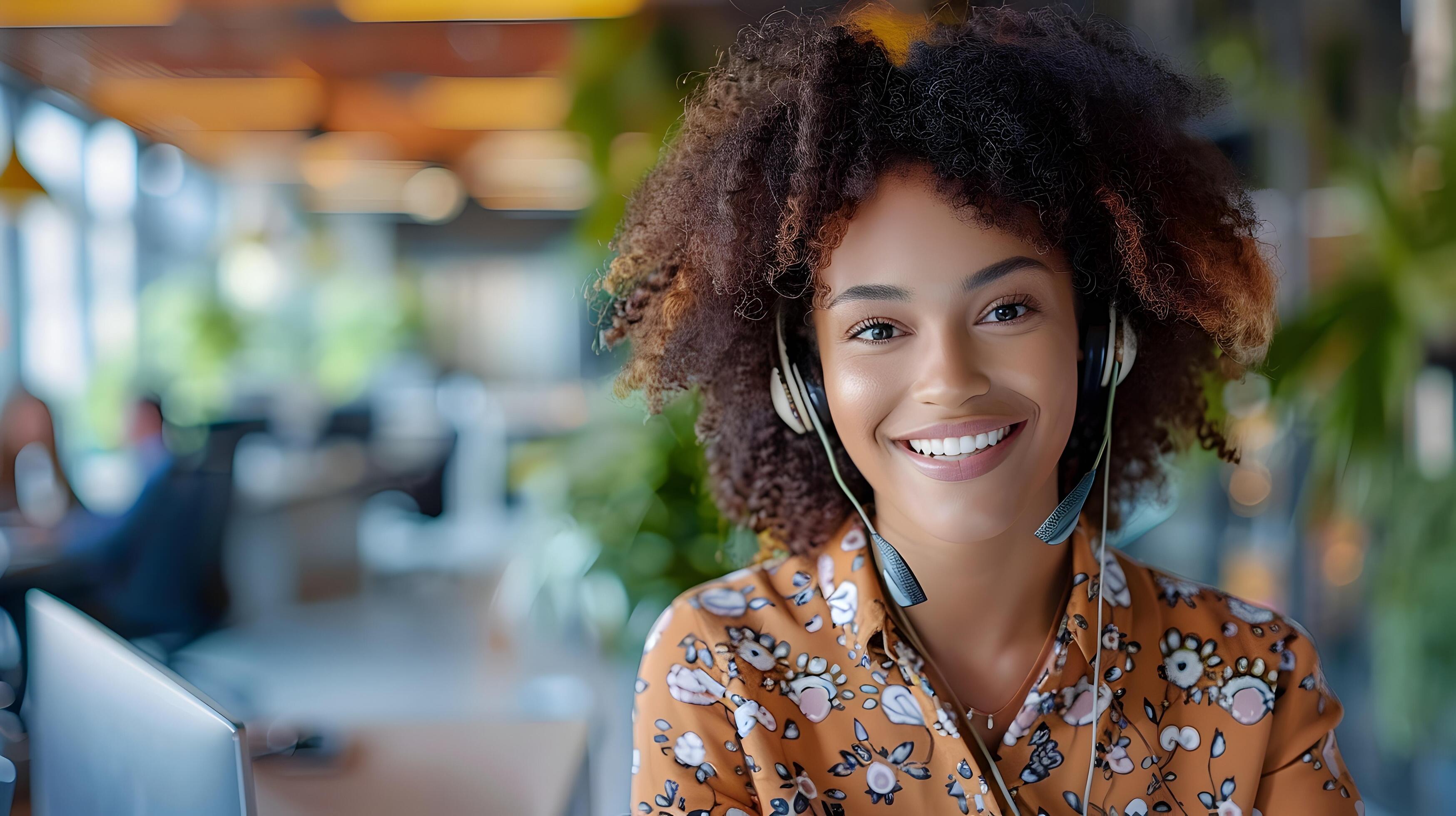 Friendly Young Professional Woman Working on Laptop in Cafe Stock Free