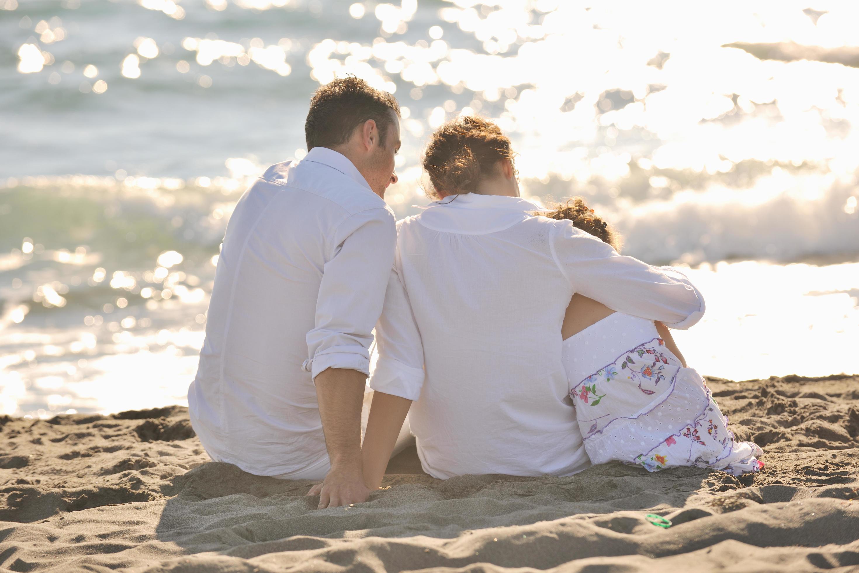 happy young family have fun on beach Stock Free