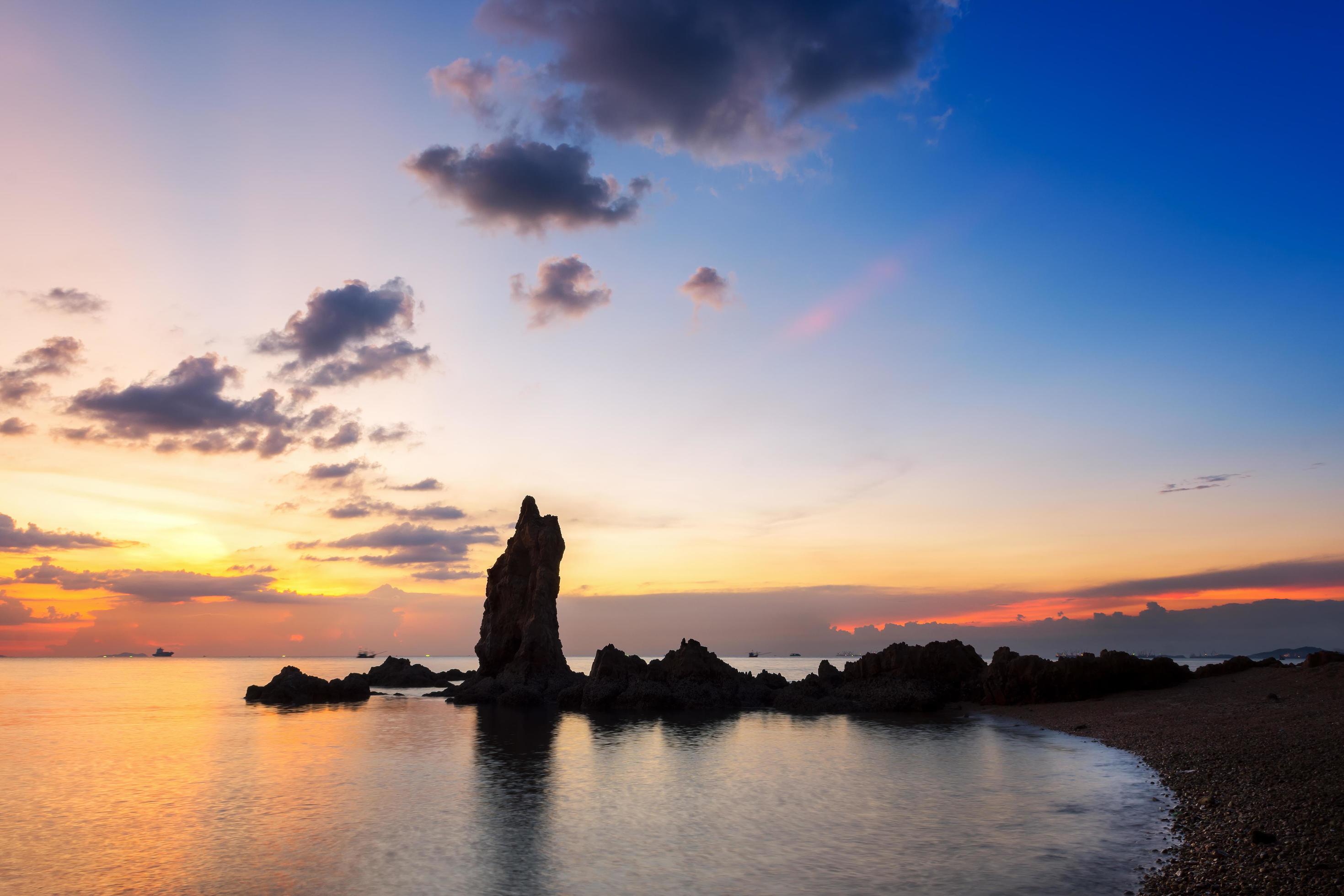 The view of the beautiful stone pillars in the middle of the sea, Chonburi province at sunset. Stock Free