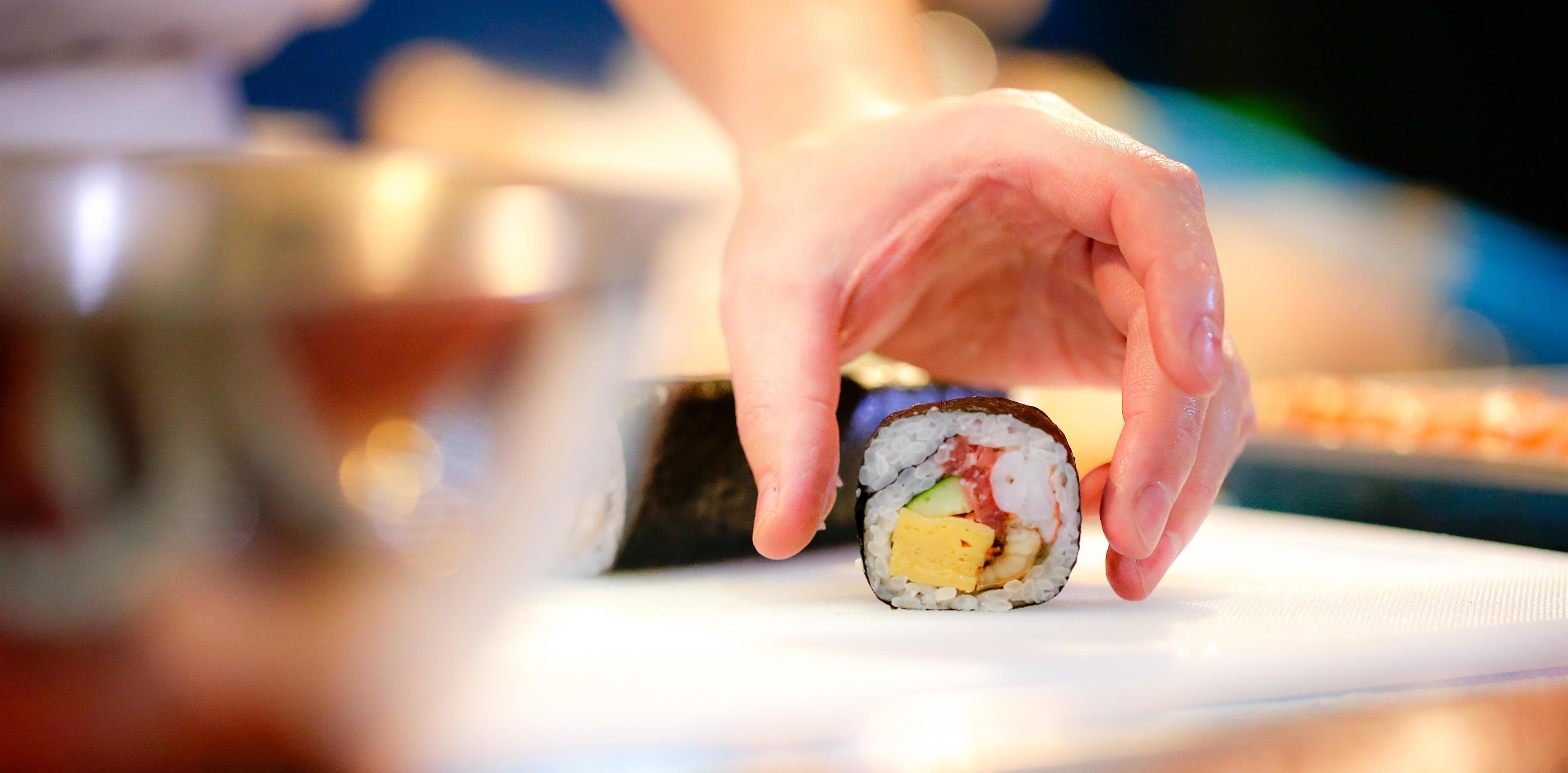 chef hands preparing japanese food, chef making sushi Stock Free