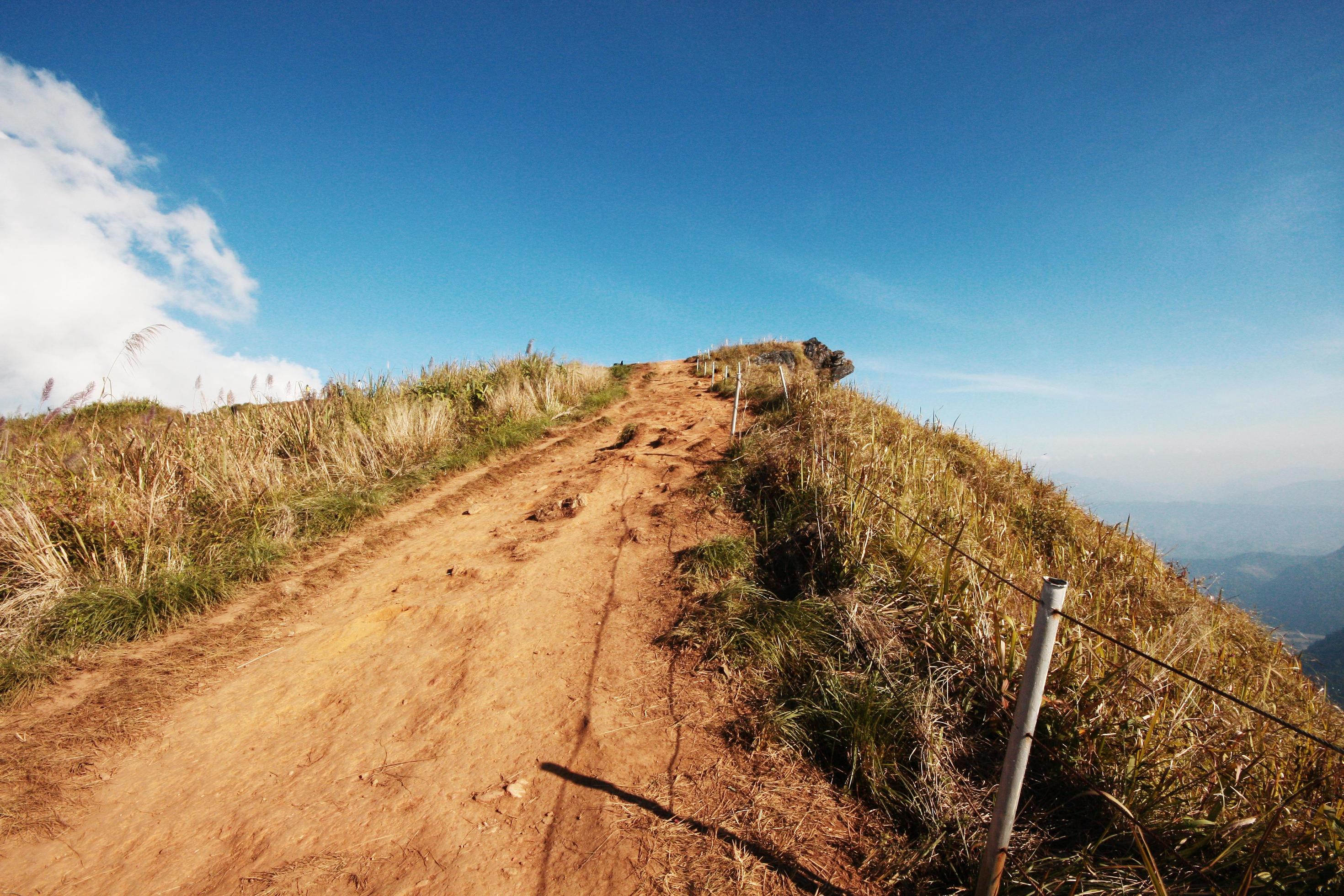 Beautiful landscape valley of mountain and blue sky in winter at Phu Chee Fah hill northern of Thailand Stock Free