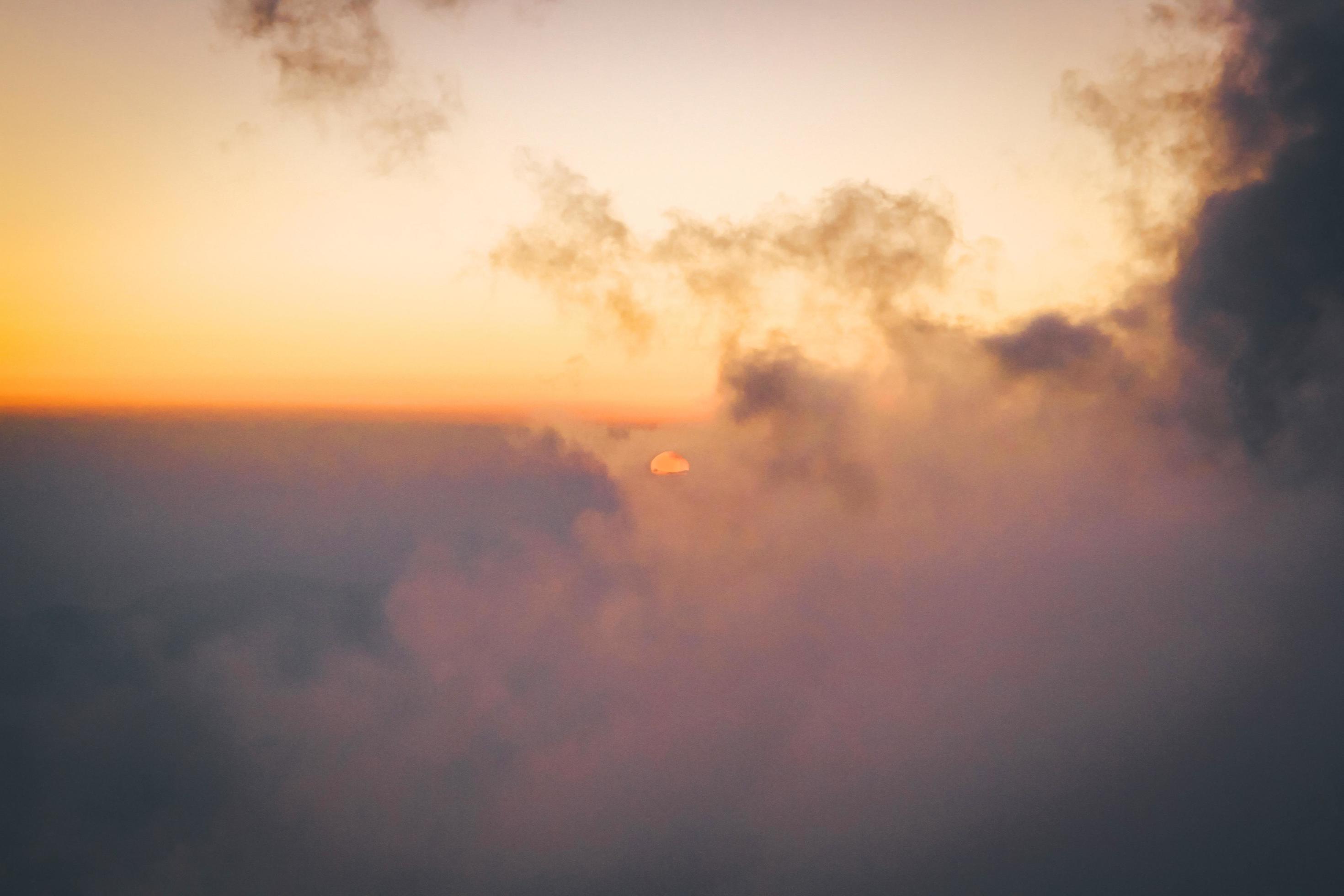 Sunset in sky and cloud, beautiful colorful twilight time with silhouette of mountain. Stock Free