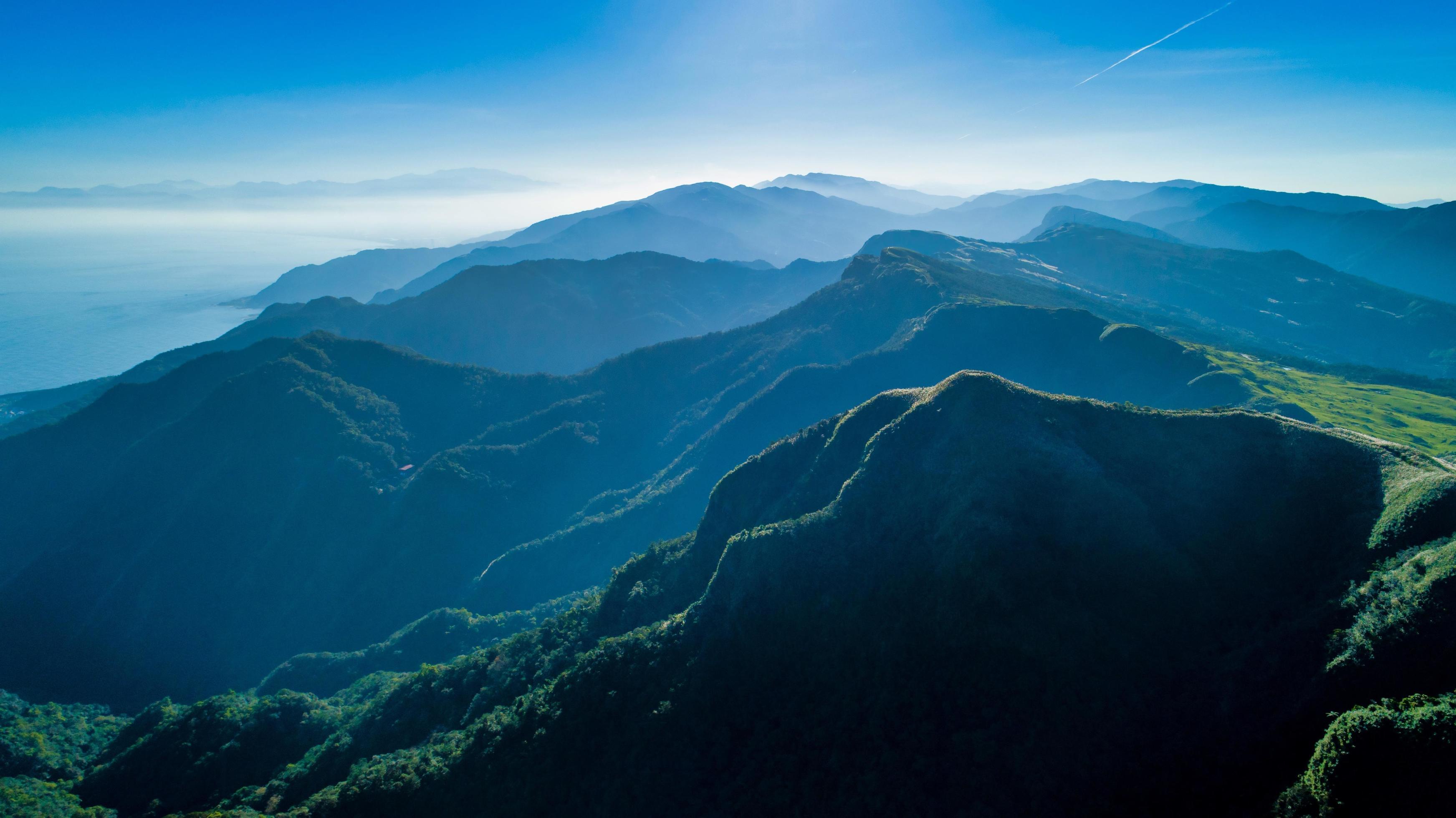 Foggy mountains and a blue sky Stock Free