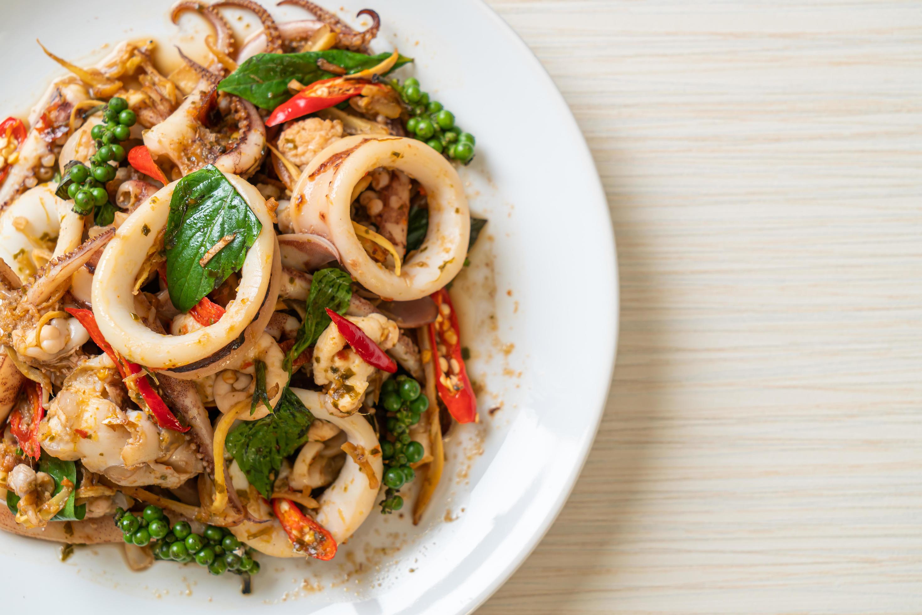 Stir-fried holy basil with octopus or squid and herb – Asian food style Stock Free