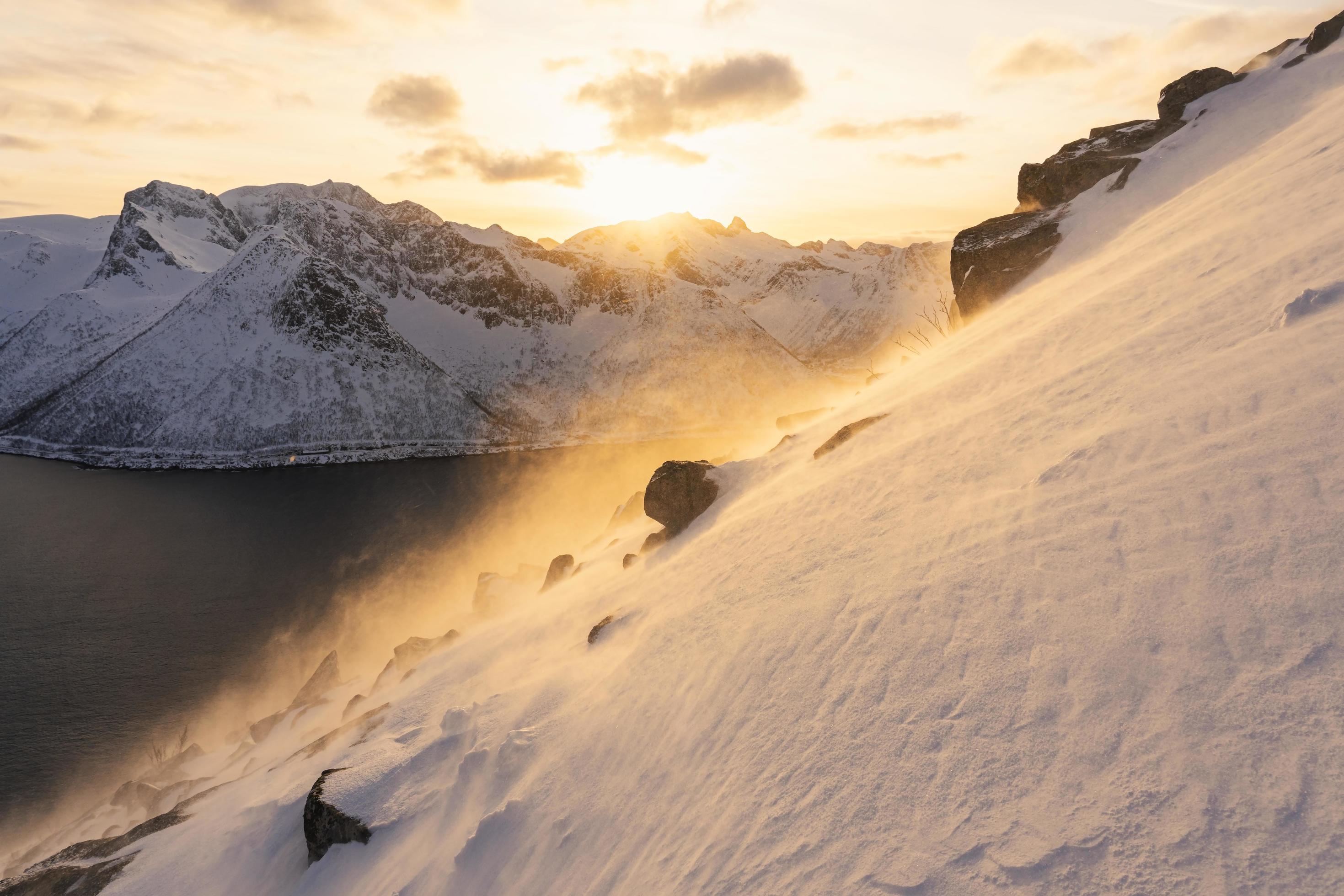 Golden sunrise on snowy mountains Stock Free