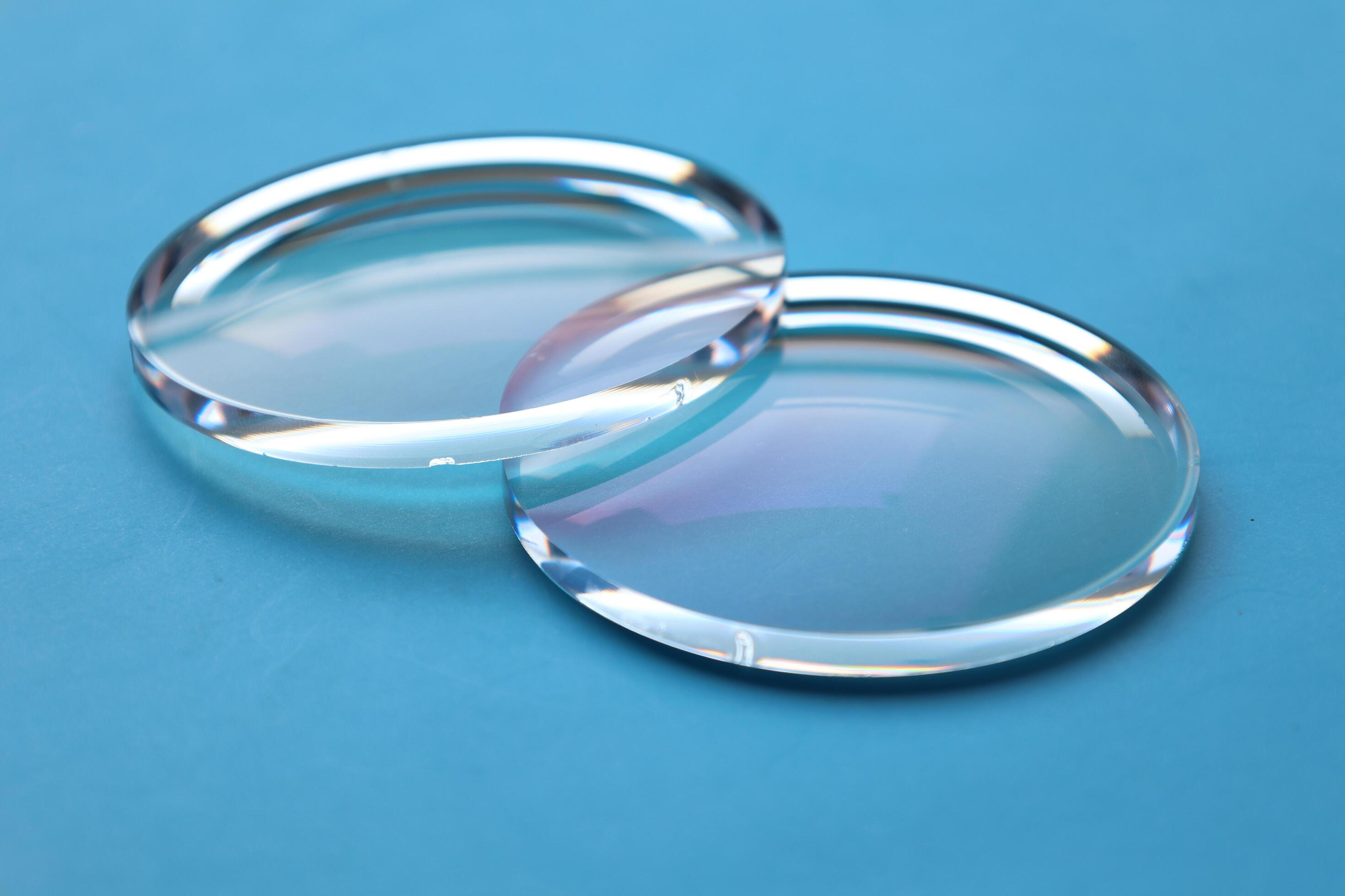 Eyeglasses lens production industry, close-up eyeglasses lenses, eyeglasses lenses, eyeglasses lenses, eyeglasses store business concept Stock Free