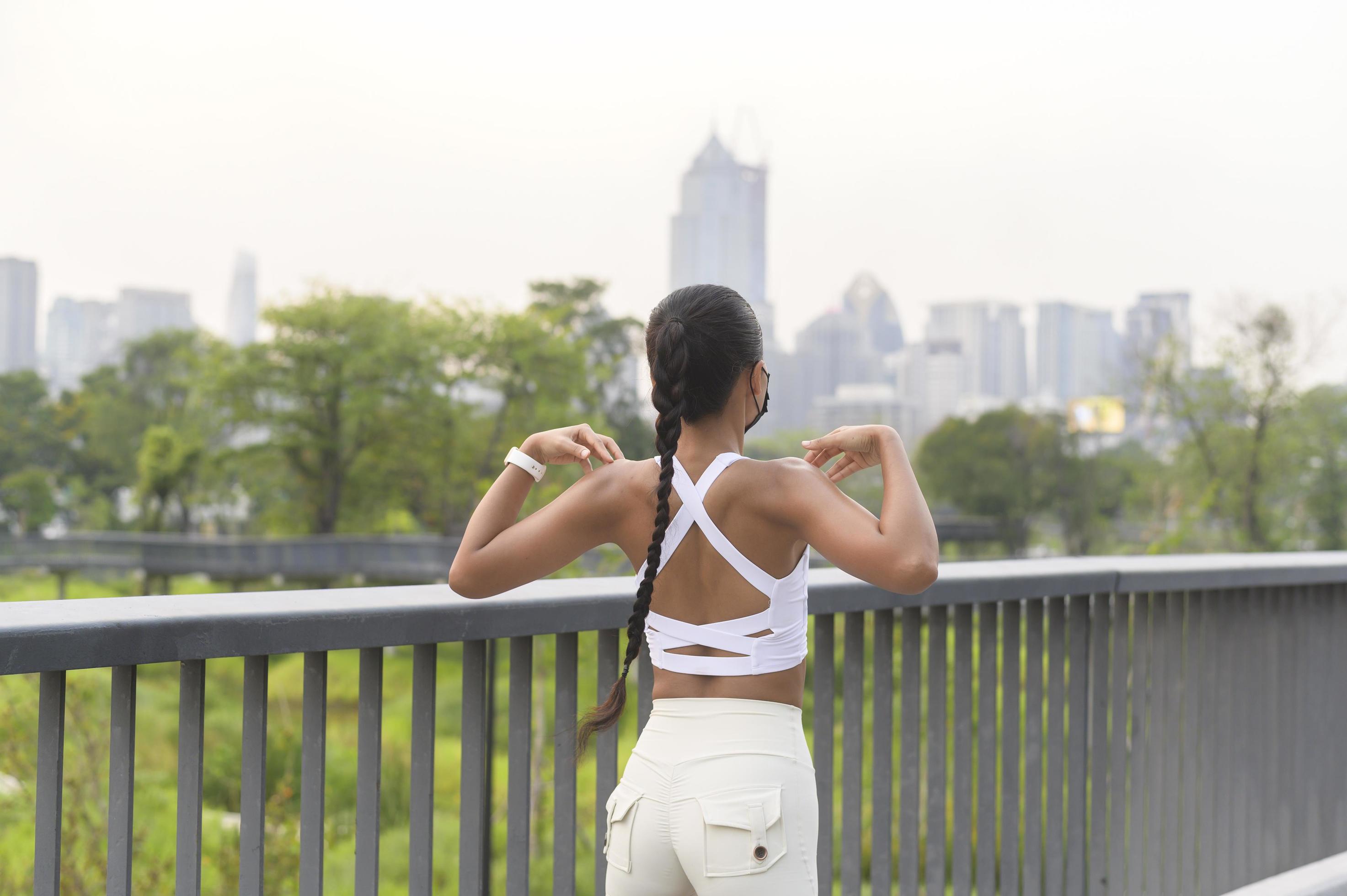 Young fitness woman in sportswear wearing face mask while exercise in city park, Health and Lifestyles. Stock Free