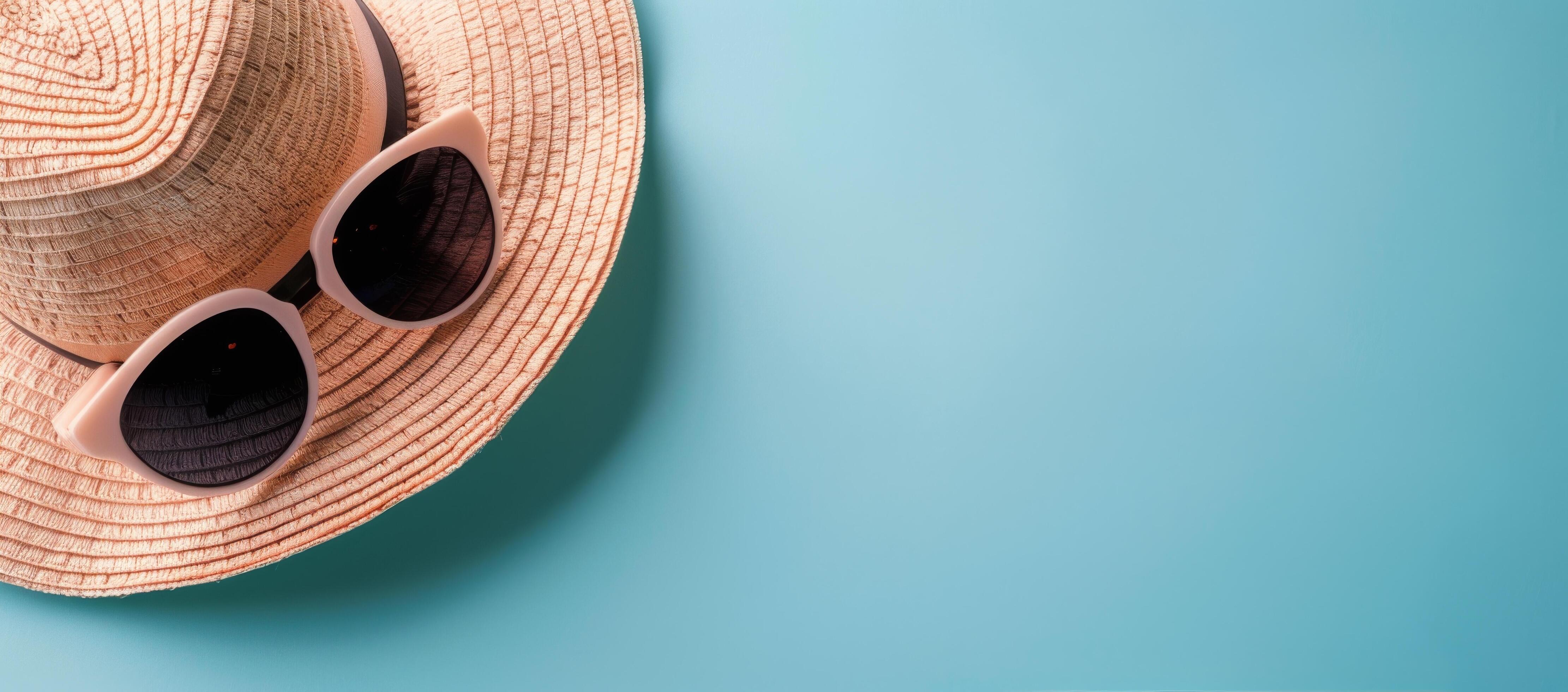 Summer Hat and Sunglasses on Light Blue Background Stock Free