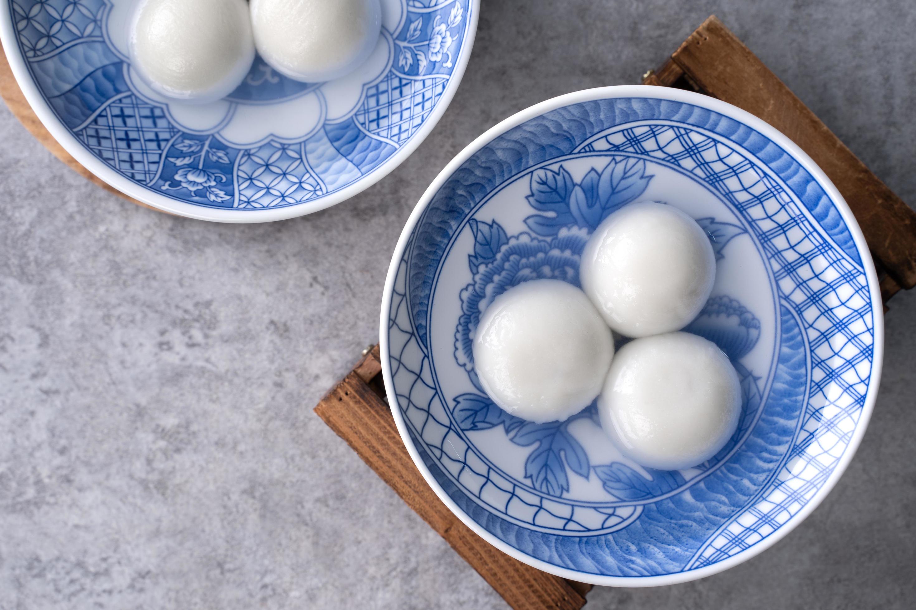 Top view of tangyuan in a bowl on gray background for lunar new year food. Stock Free