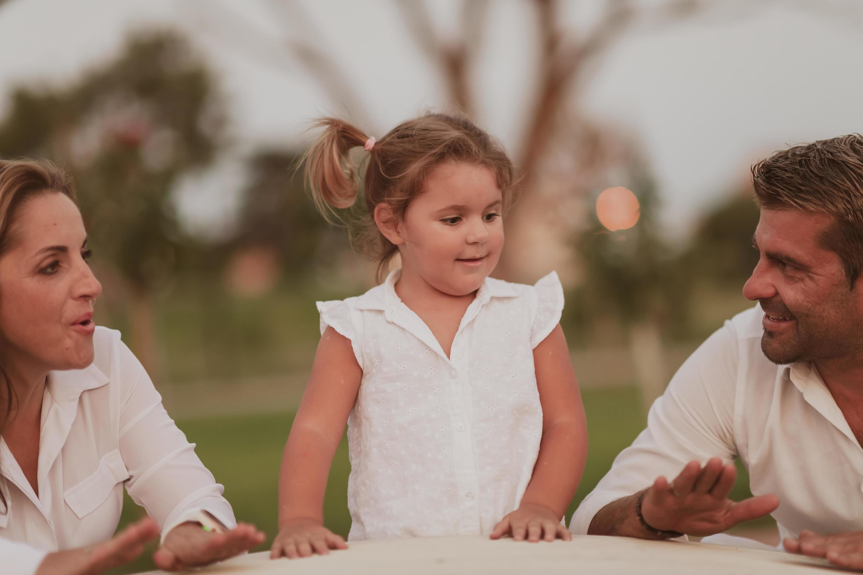 Senior couple in casual clothes with their children spending time in park a vacation together. Family time . Selective focus Stock Free