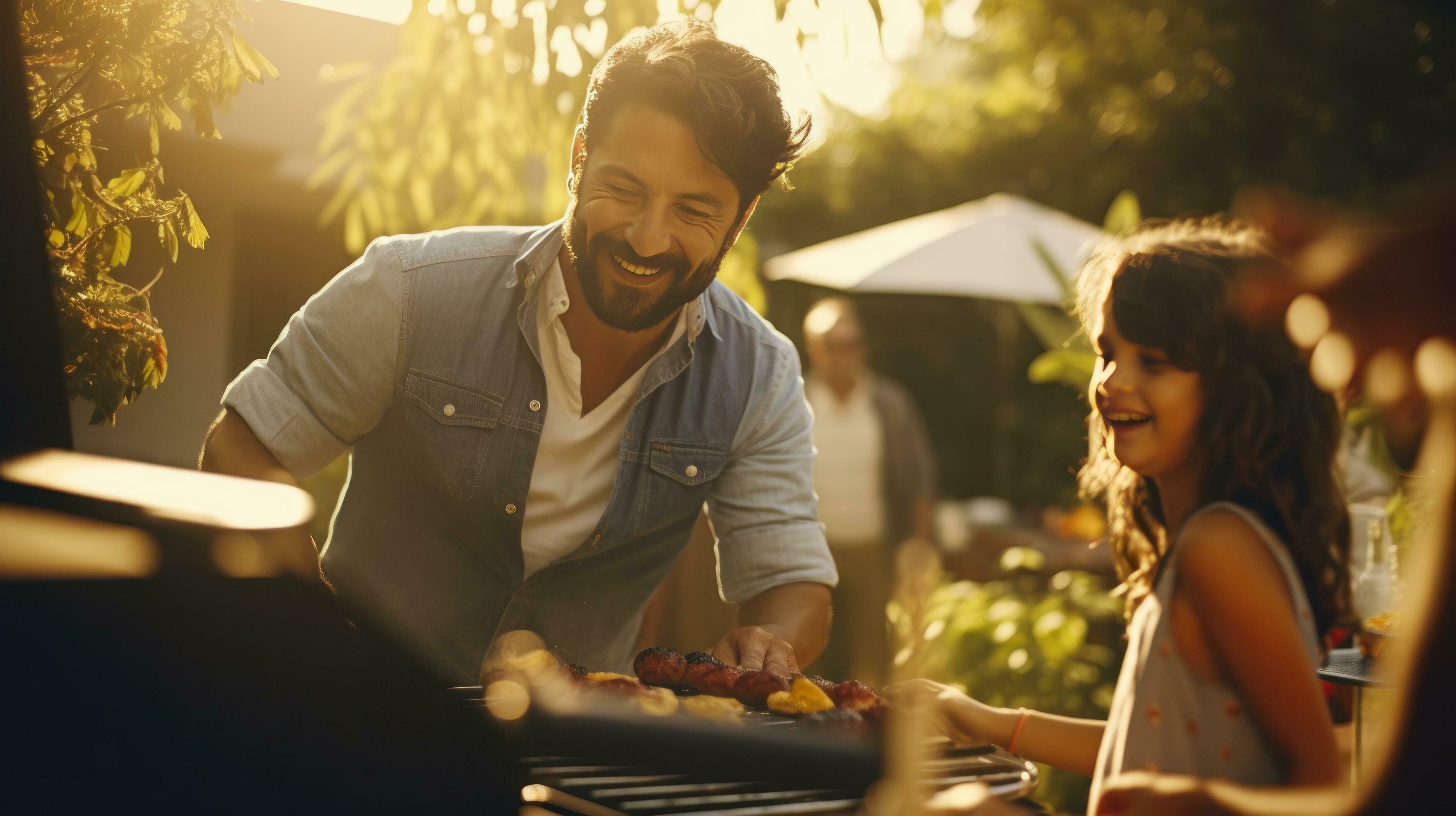 Young family is grilling at the barbecue Stock Free