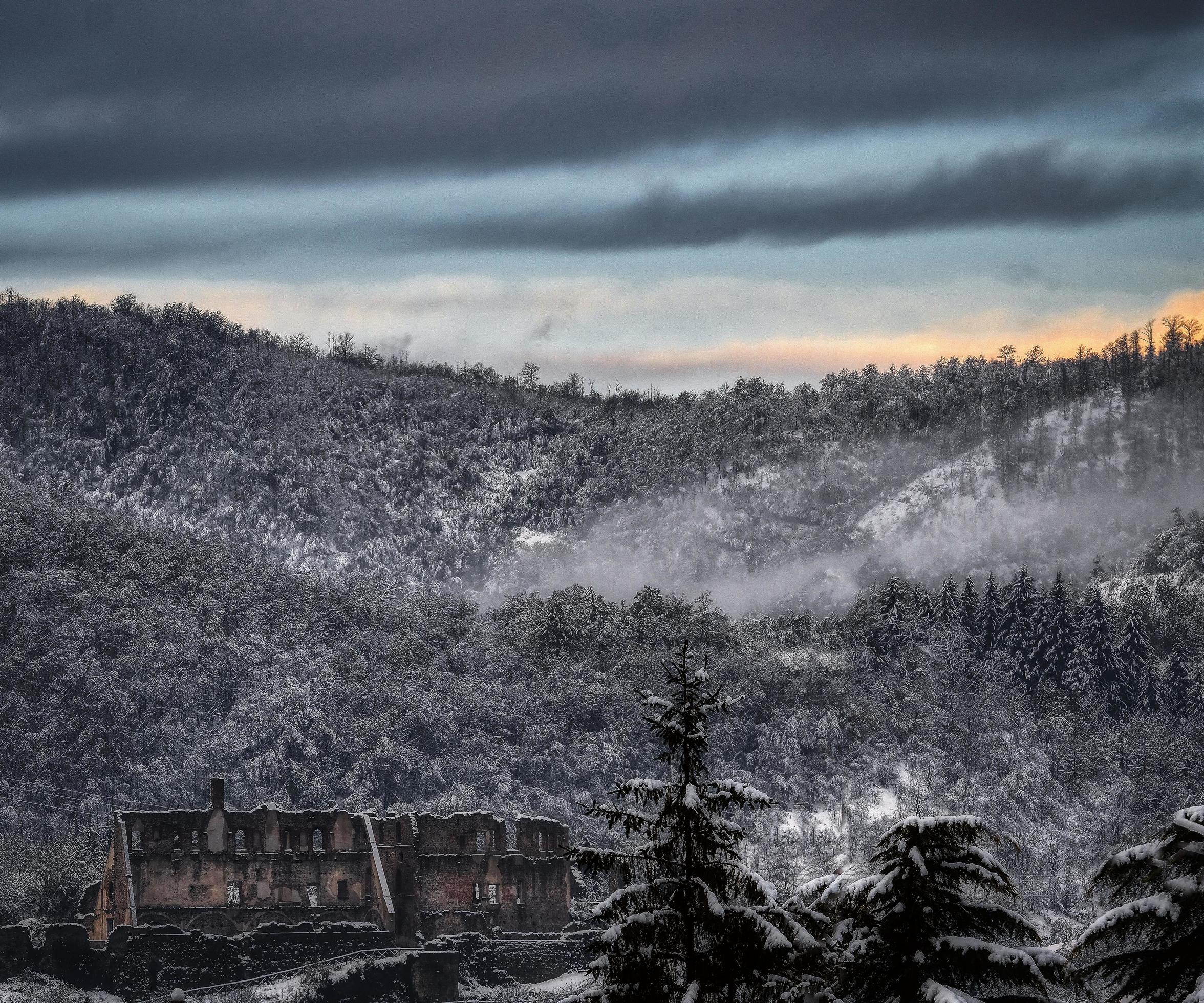 mountains covered by snow covering the trees, during the winter of 2023 in italy Stock Free