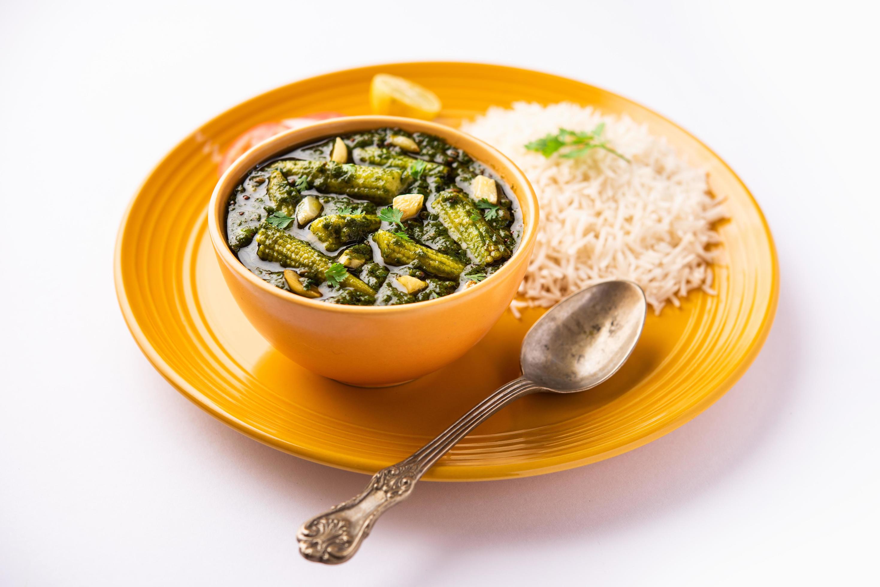 palak baby corn sabzi also known as spinach makai curry served with rice or roti, Indian food Stock Free