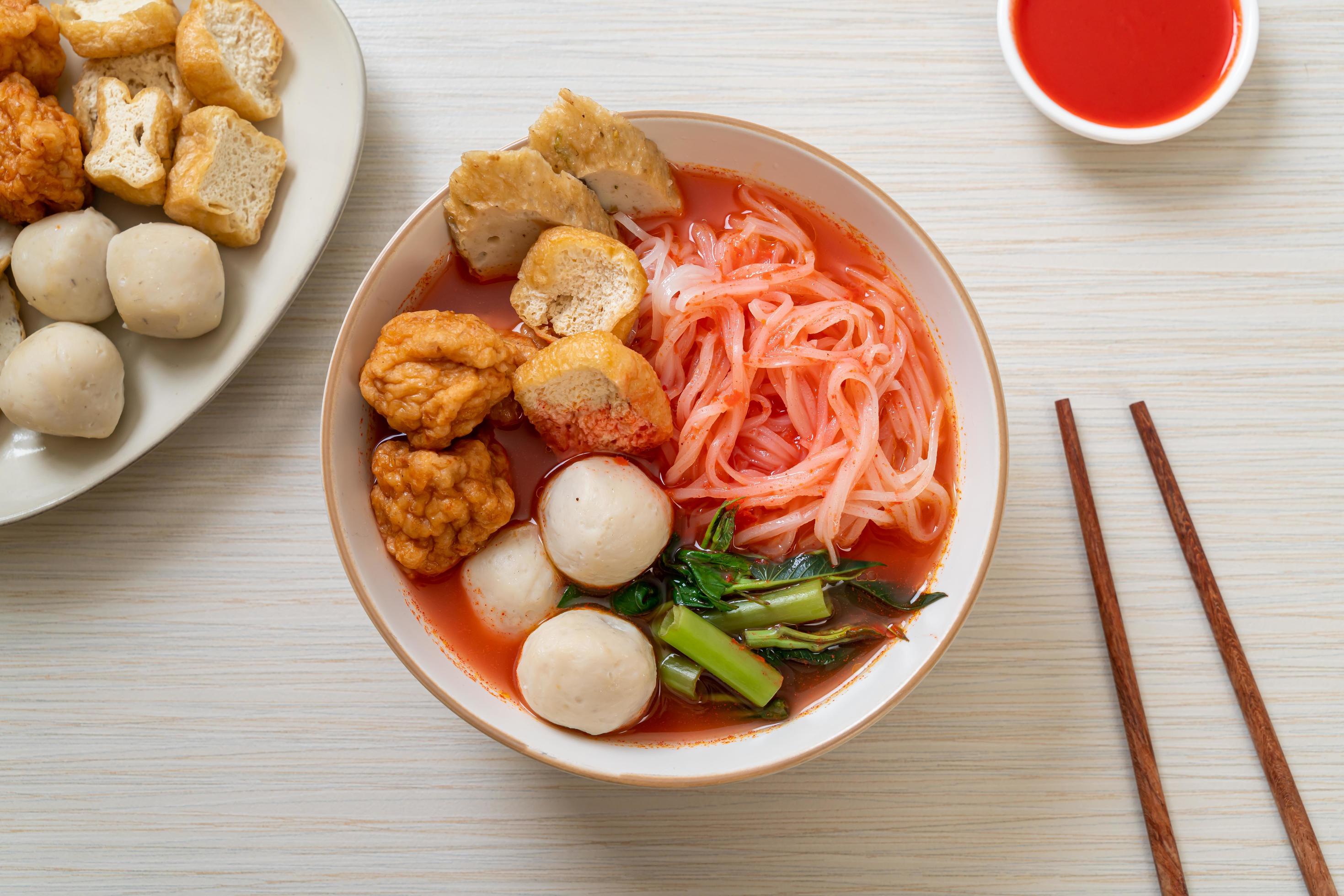 Small flat rice noodles with fish balls and shrimp balls in pink soup, Yen Ta Four or Yen Ta Fo – Asian food style Stock Free