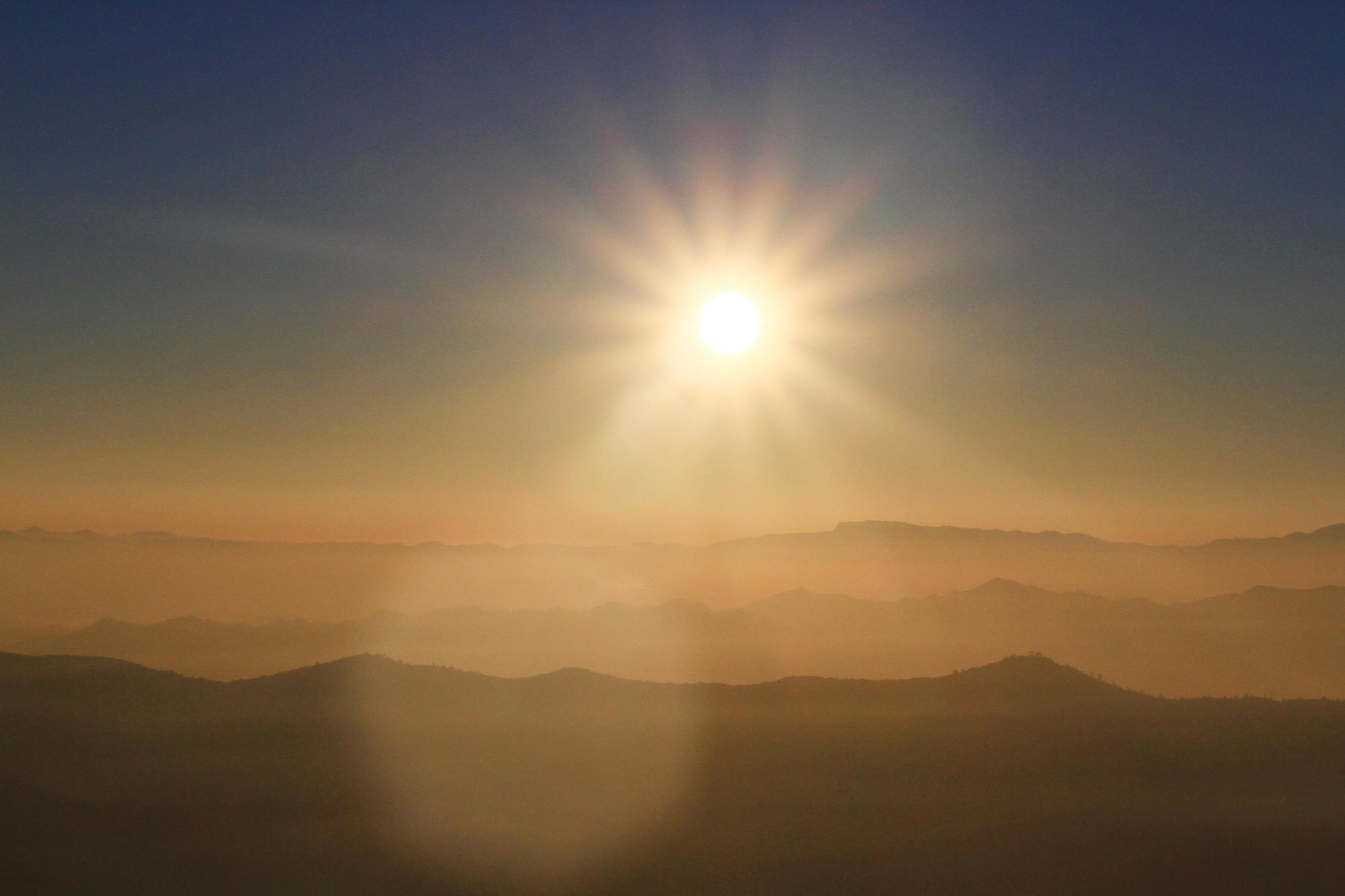 Beautiful Sunset and sunrise on sky and golden twilight time with mist and fog in valley of mountain layer Stock Free