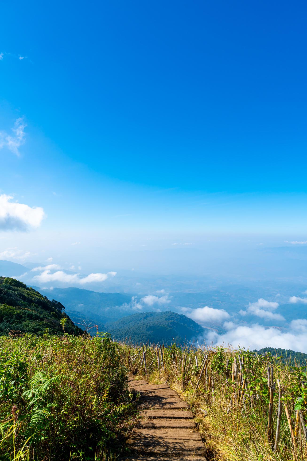 Beautiful mountain layer with clouds and blue sky at Kew Mae Pan Nature Trail in Chiang Mai, Thailand Stock Free