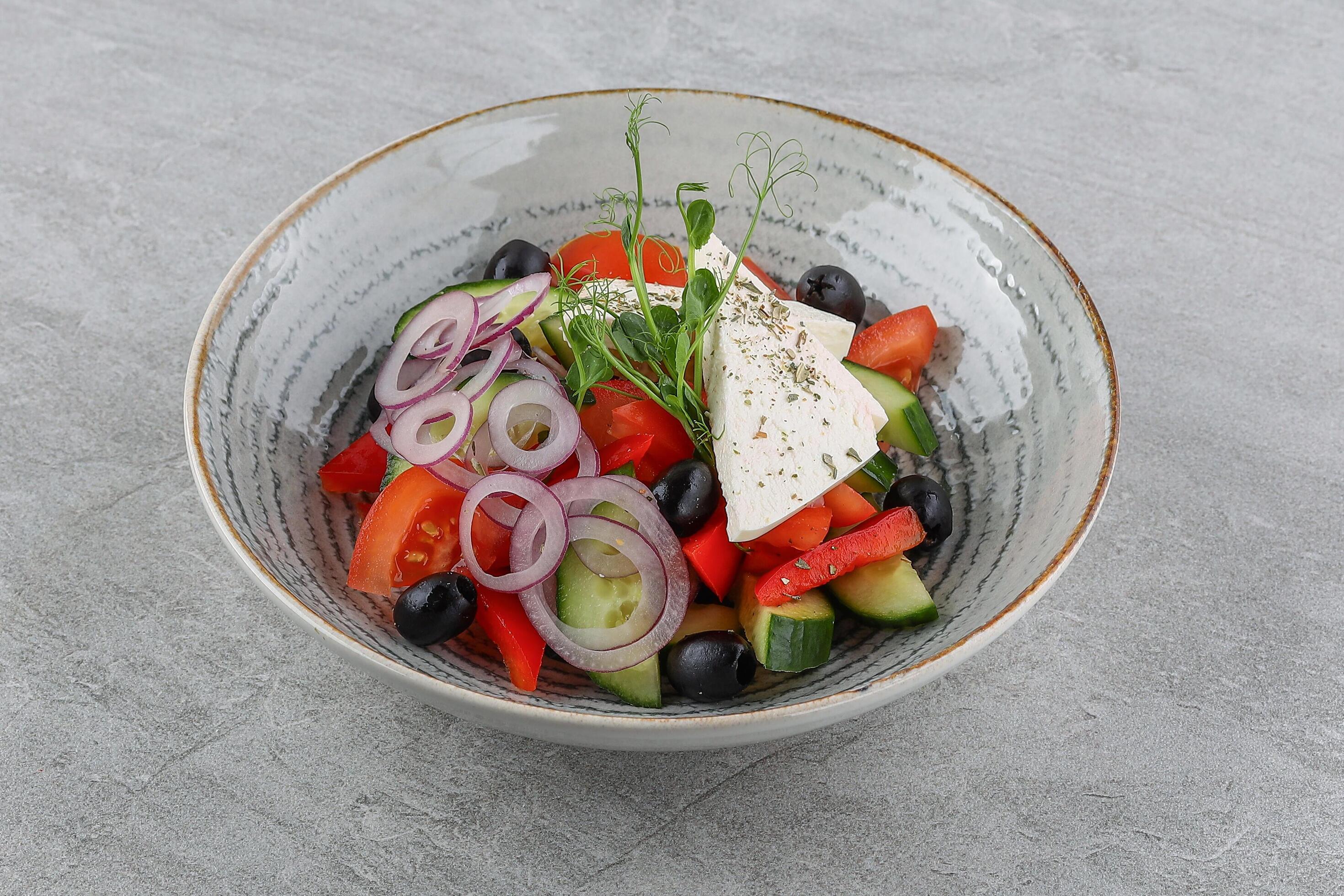 Greek salad on a stone background studio shooting 4 Stock Free