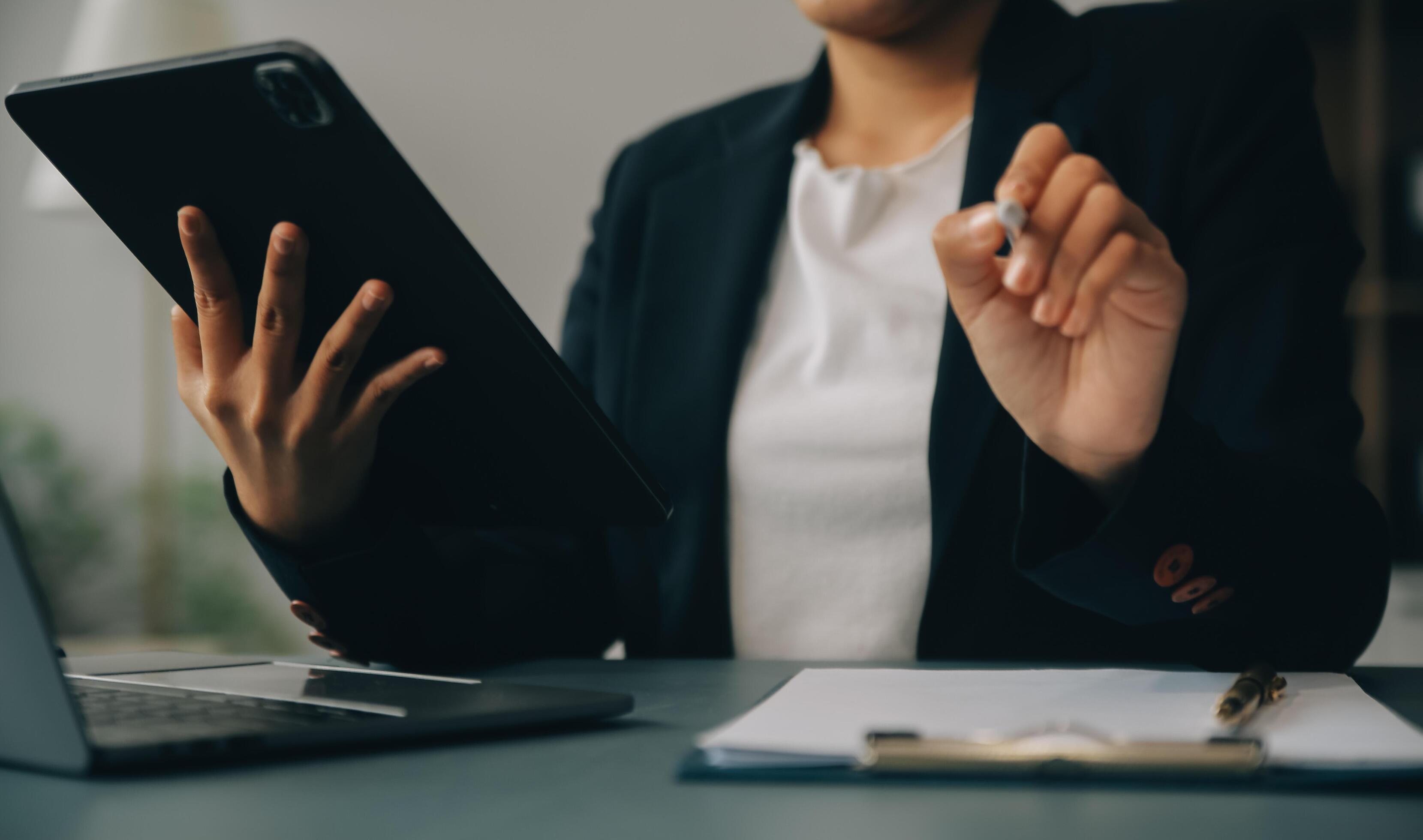 Portrait of a successful business woman using digital tablet Stock Free