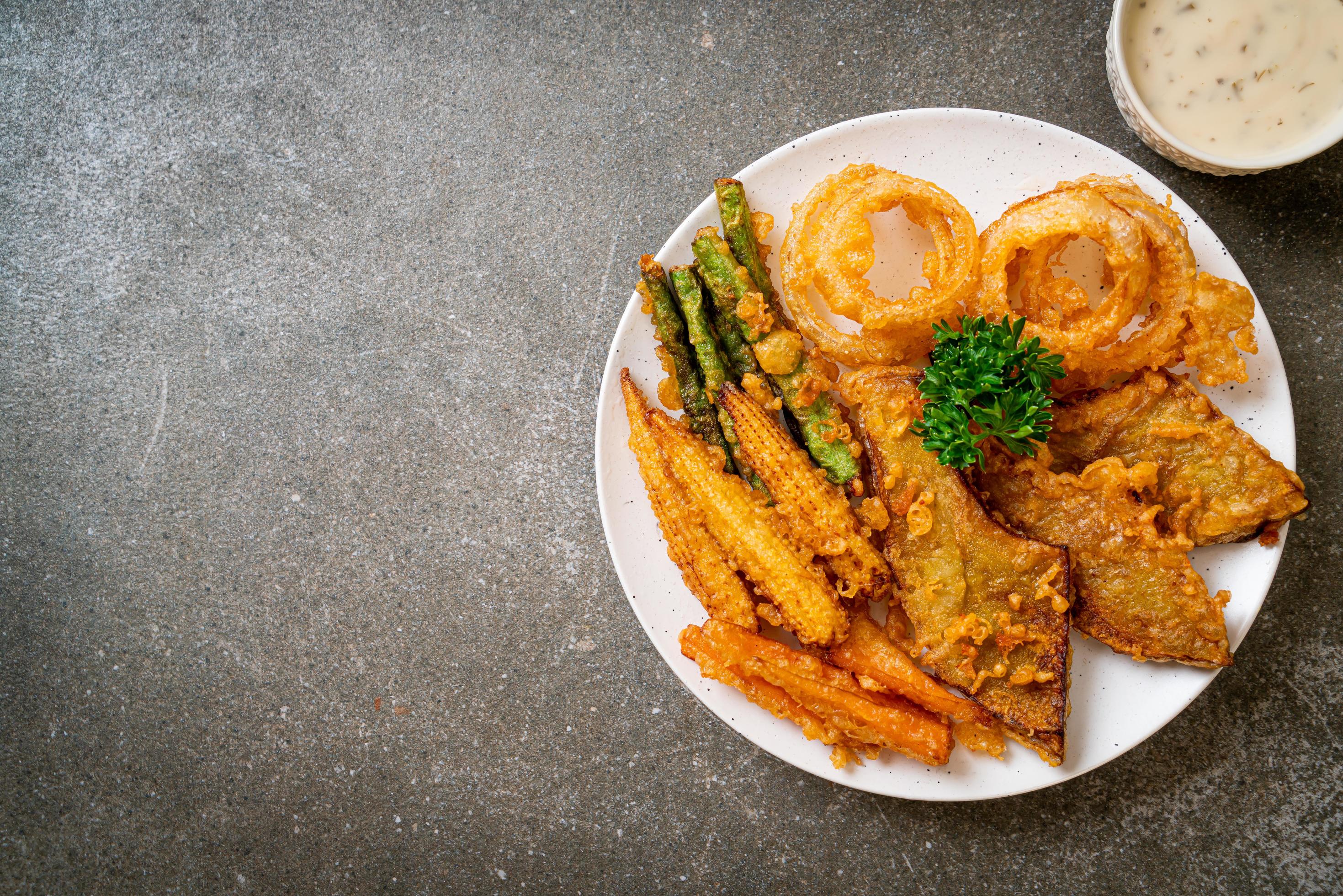 Fried mixed vegetables of onions, carrot, baby corn, pumpkin, or tempura – vegetarian food style Stock Free