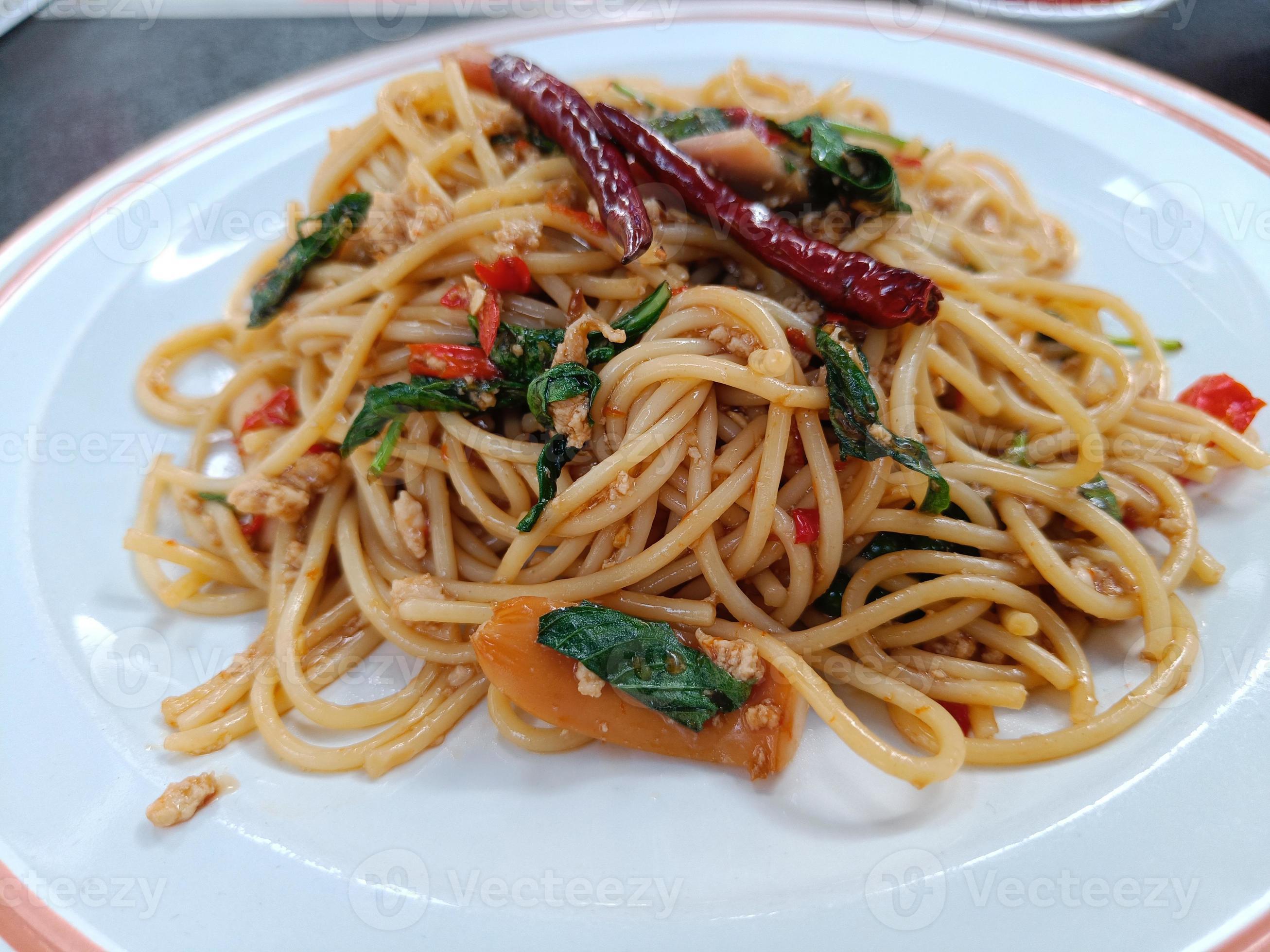 Spaghetti with Spicy pork, sausage and basil.Thai fusion food. side view Stock Free