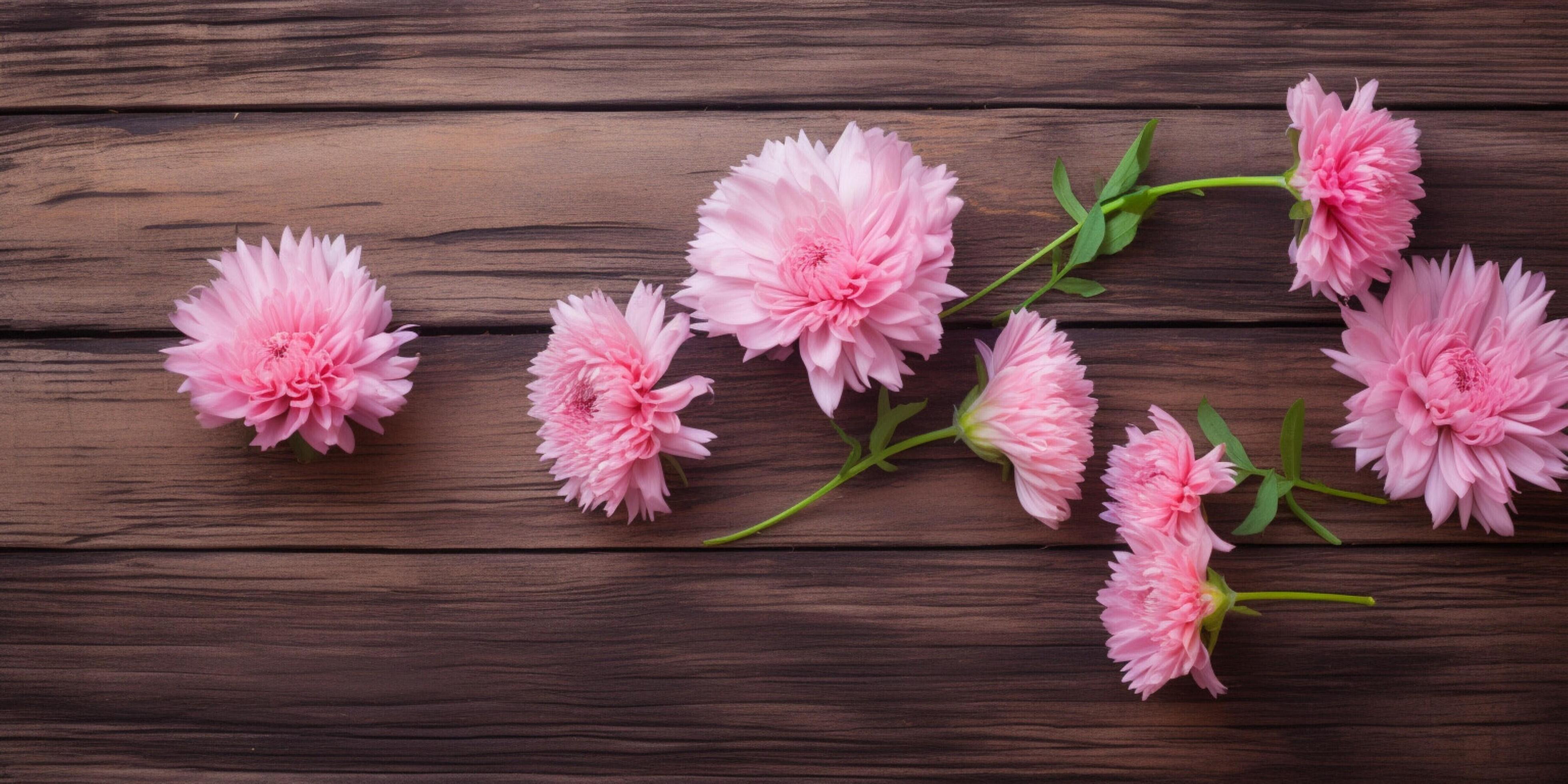 Pink flowers on a wooden table Stock Free