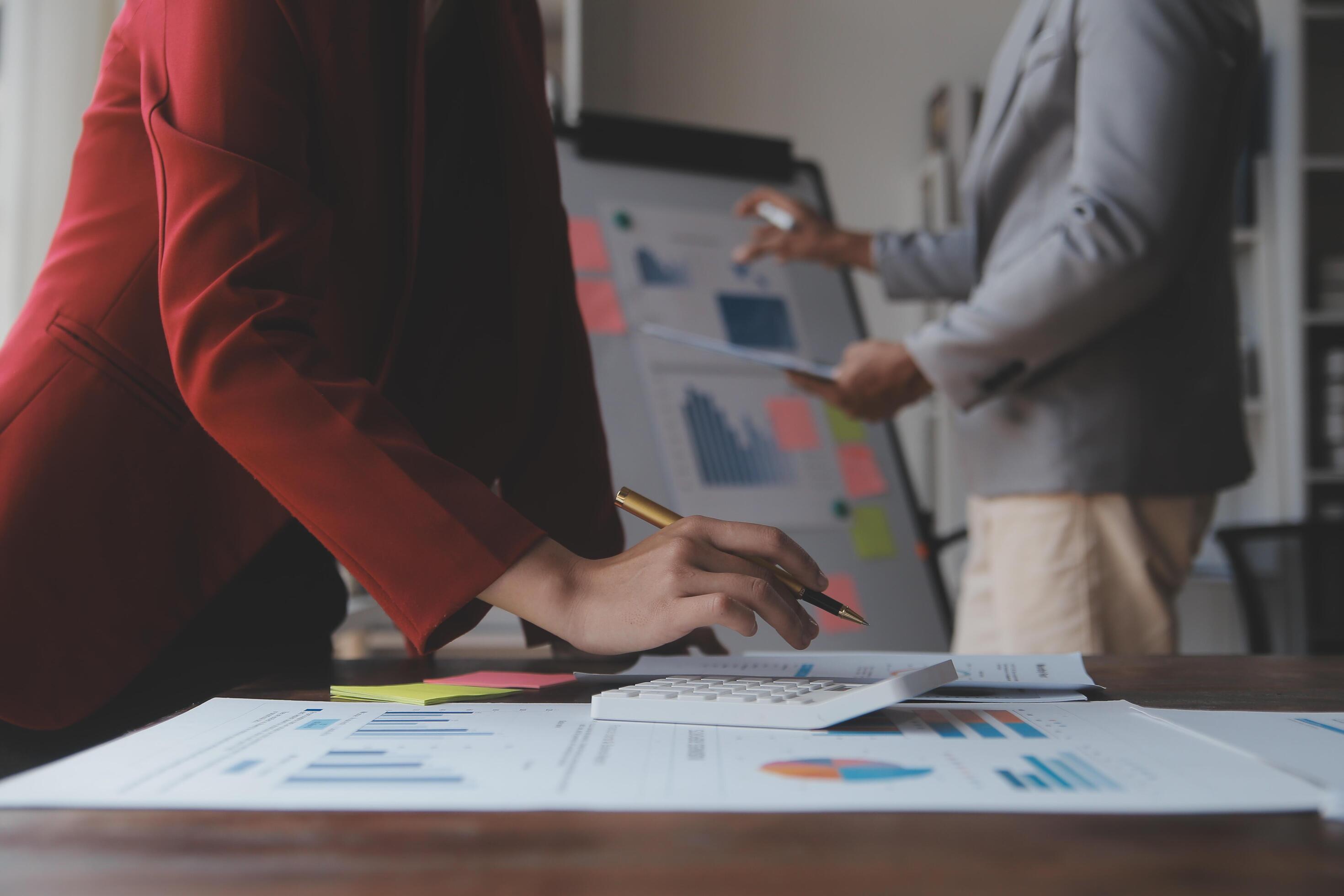 Close up of Business team analyzing income charts and graphs with modern laptop computer. Business analysis and strategy concept. Stock Free