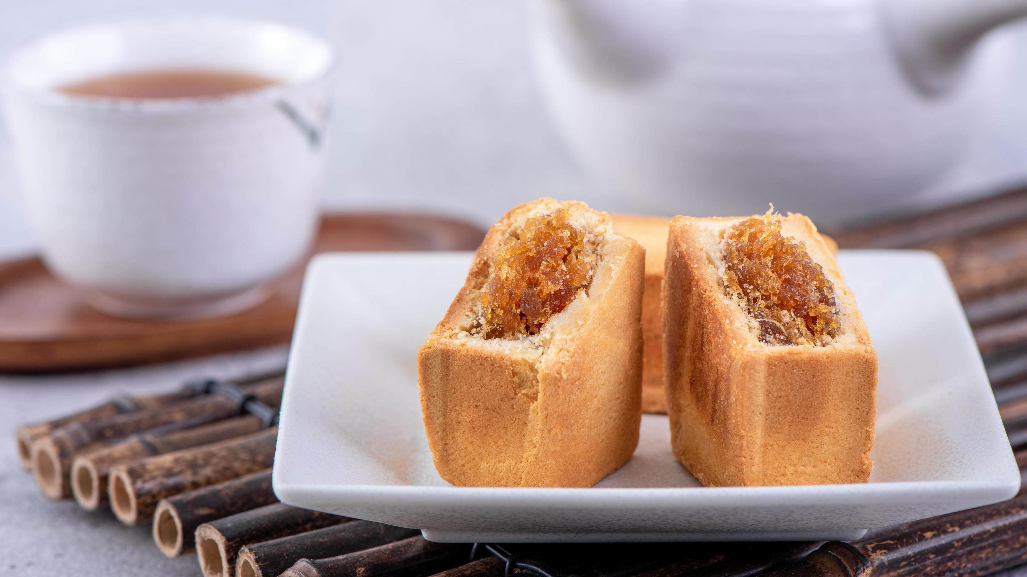 Pineapple cake pastry – Taiwanese famous sweet delicious dessert food with tea, close up, copy space design. Stock Free