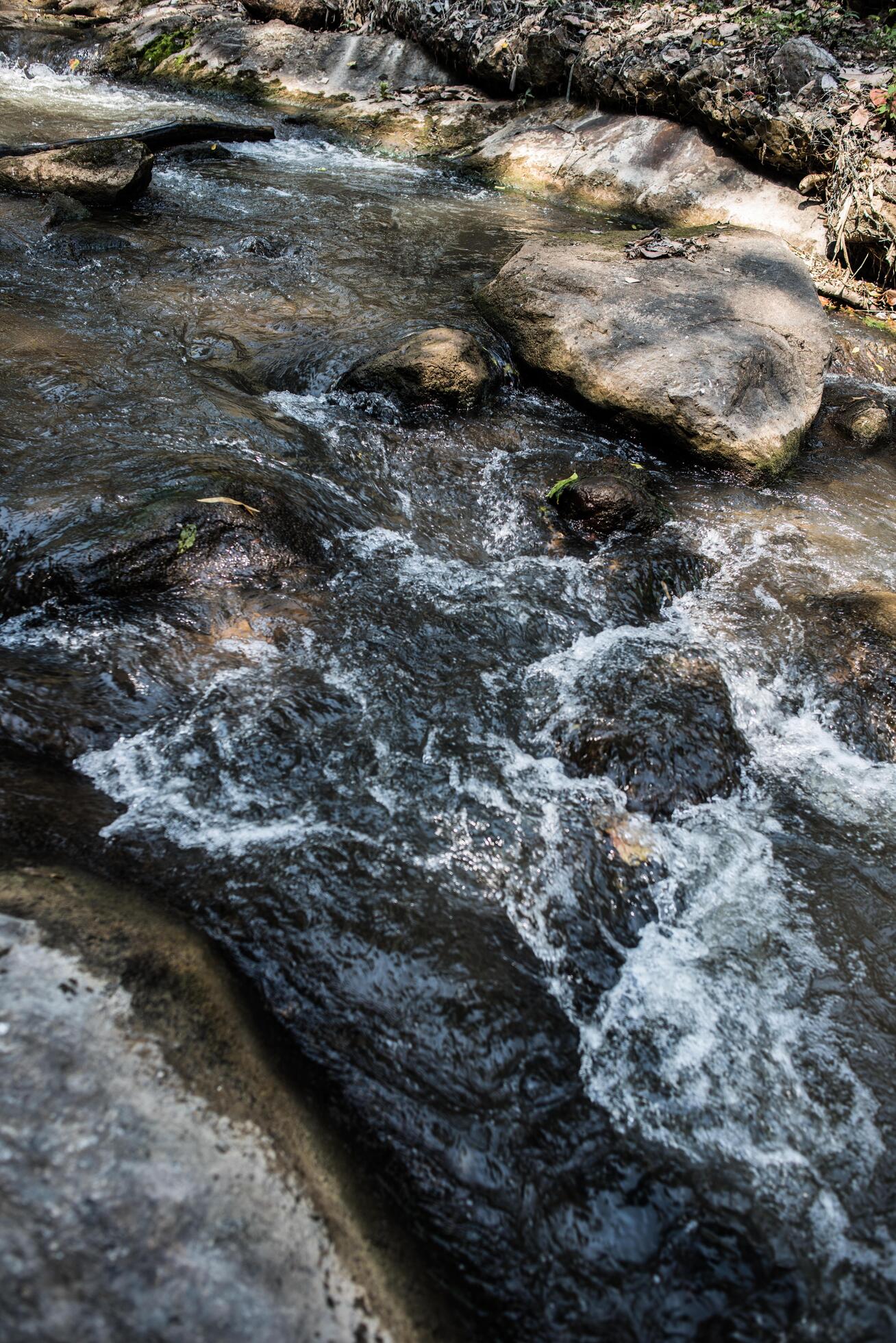 Waterfall in the nature and stone background Stock Free