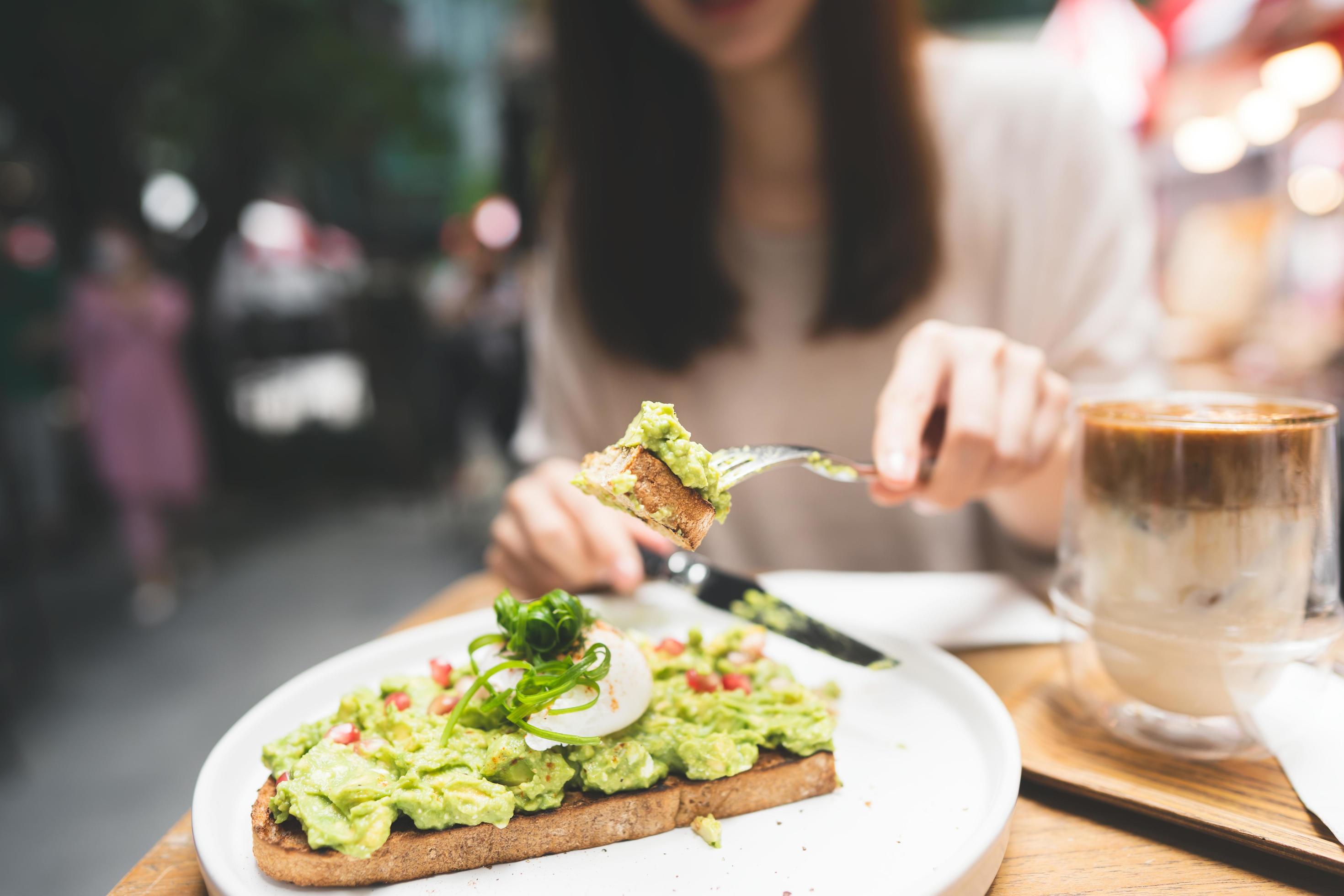 Guacamole avocado healthy food and asian woman background at outdoor restaurant on day Stock Free