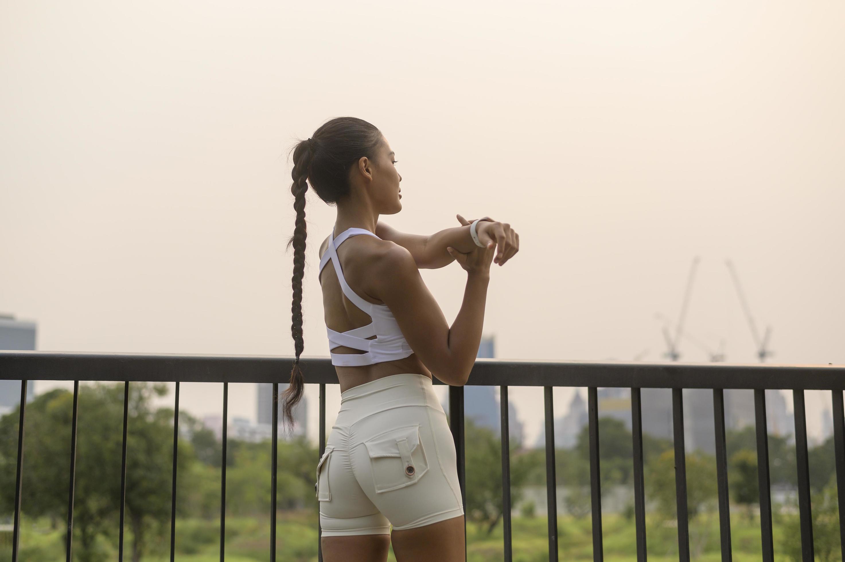 A young fitness woman in sportswear exercising in city park, Healthy and Lifestyles. Stock Free