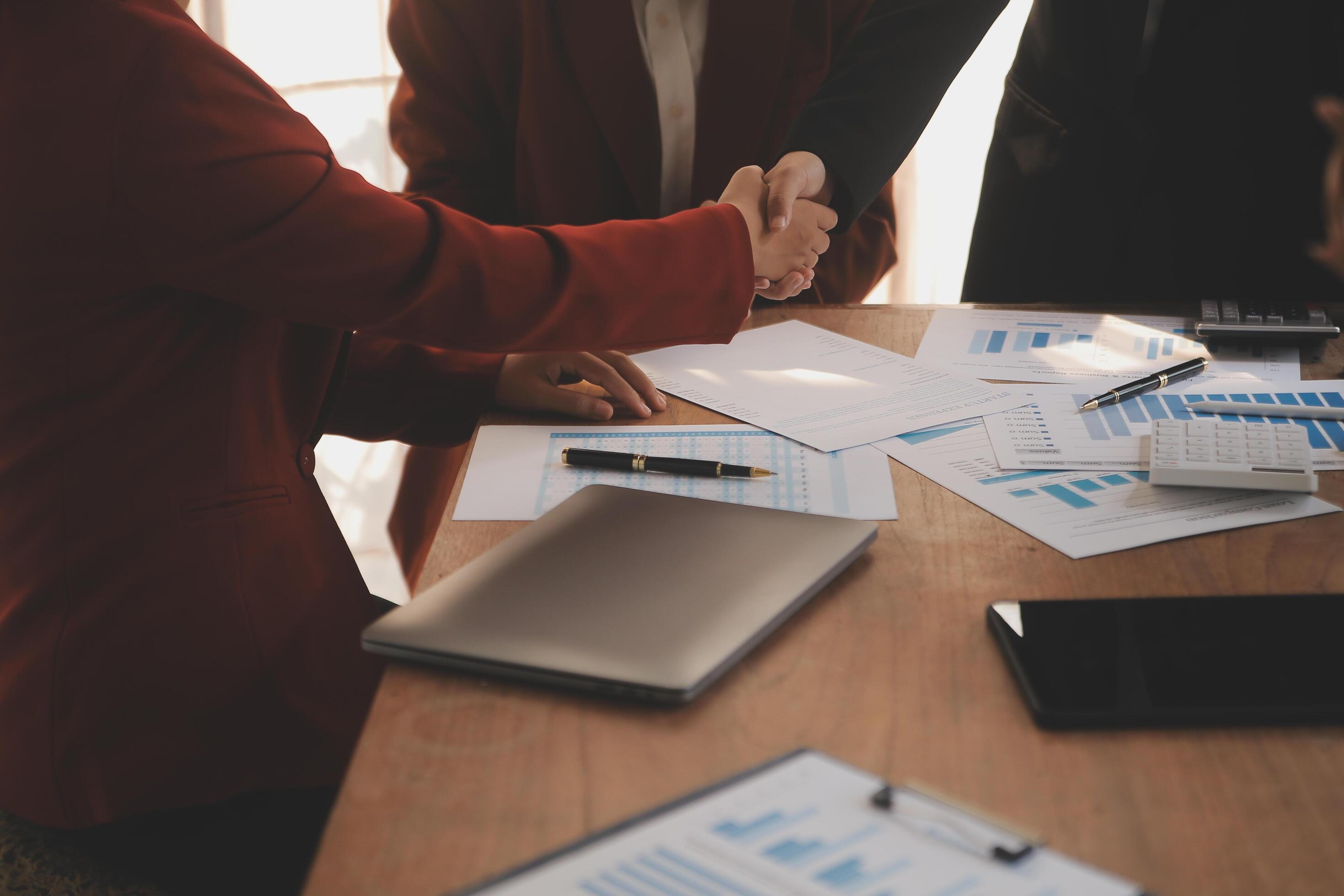 Close up of a team of business people having a meeting to analyze data for a marketing plan. Stock Free