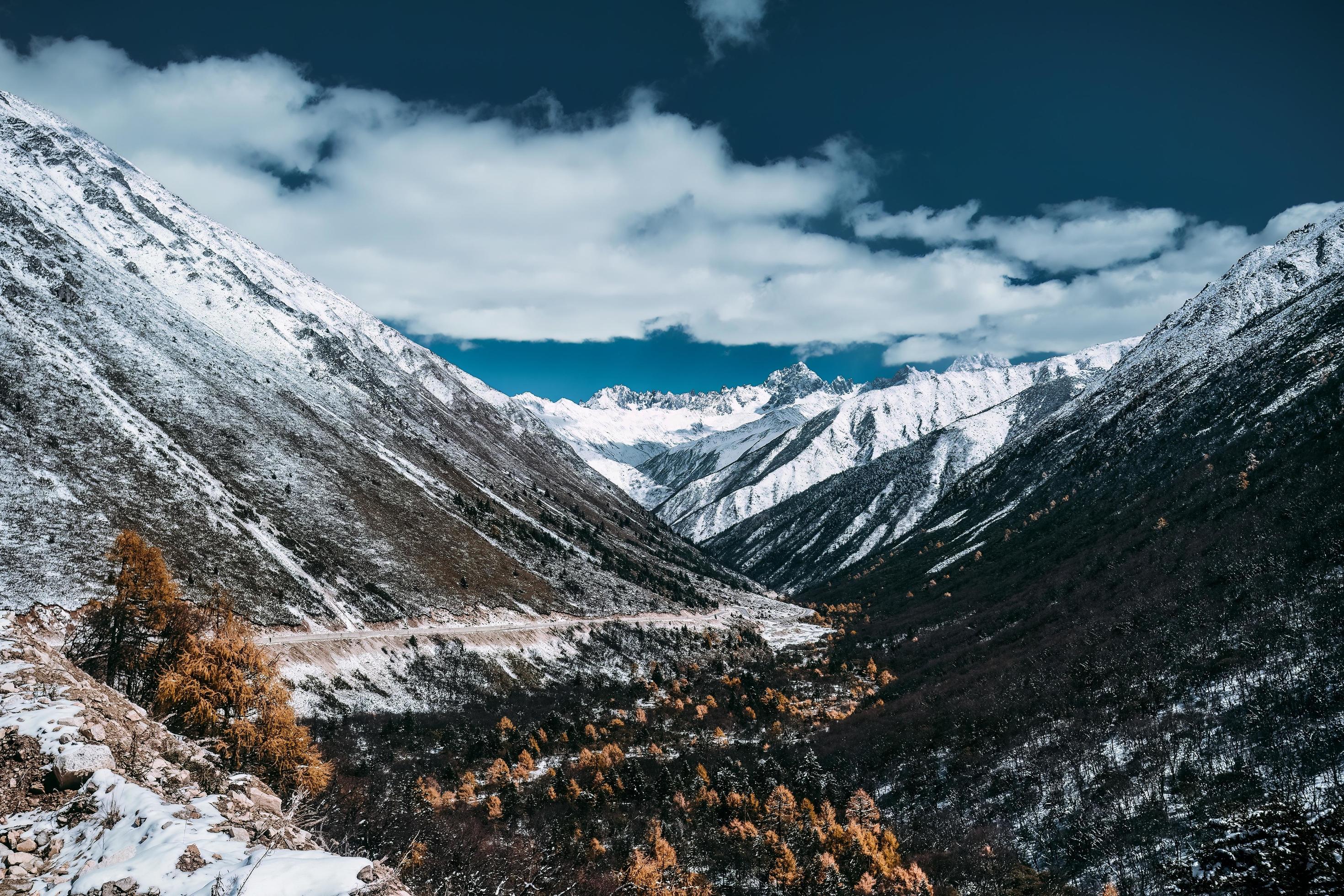 Spectacular scenery in the high mountains of western Sichuan, China, with different seasons Stock Free