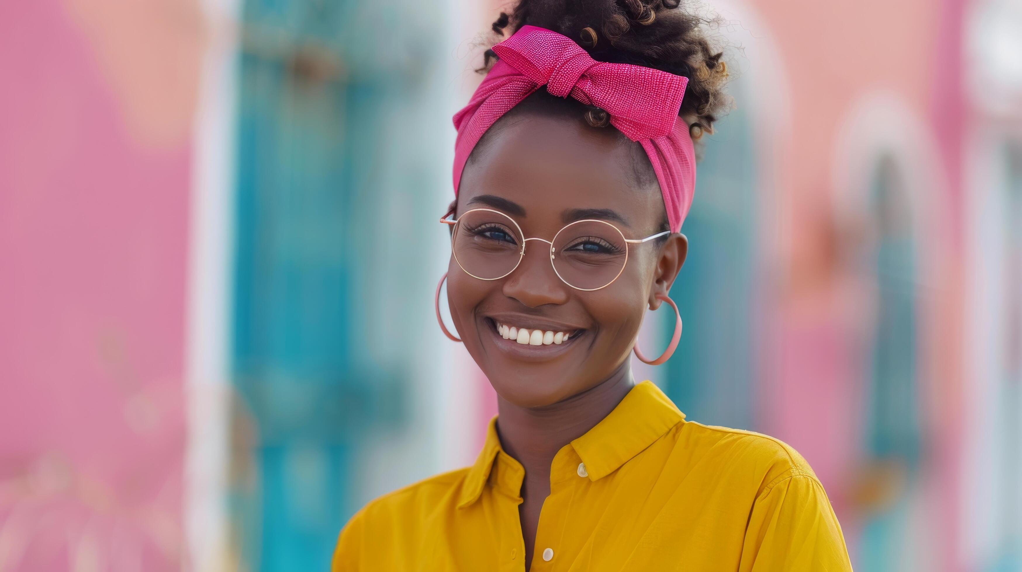 Smiling Woman in Yellow Shirt With Pink Headband Against Colorful Background Stock Free