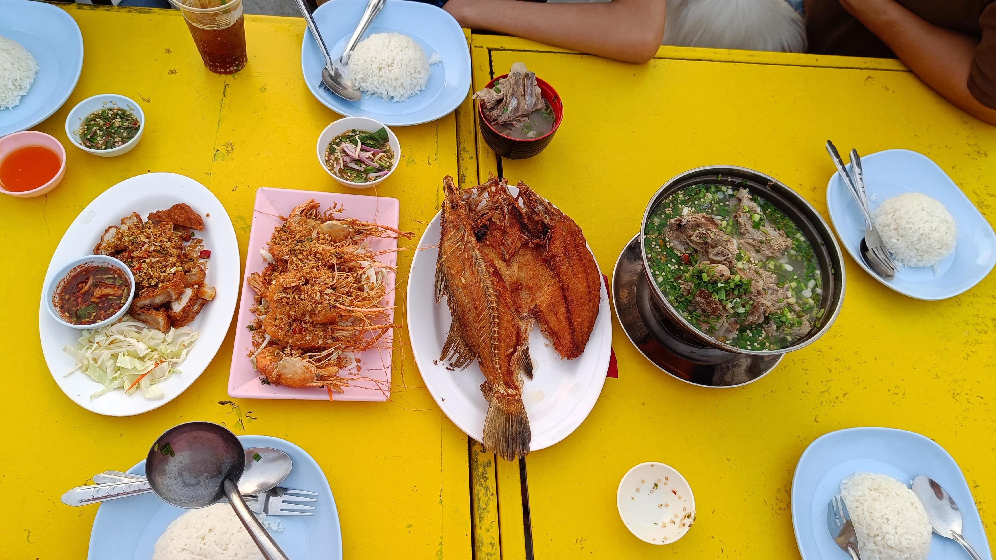 Top view Thai food set on yellow table Stock Free